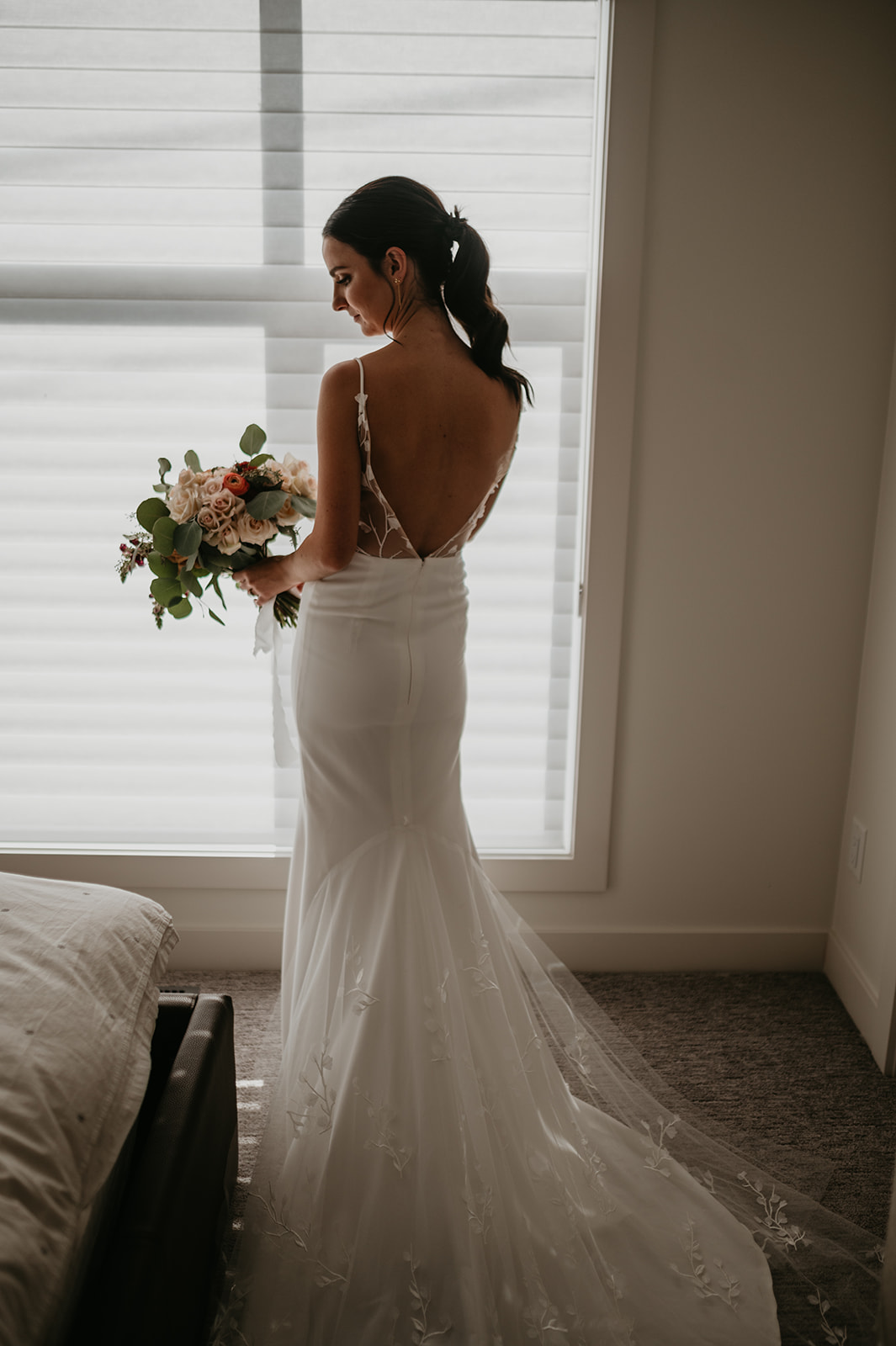 Bride wearing an anais anette dress in the morning of her wedding day in Calgary Alberta
