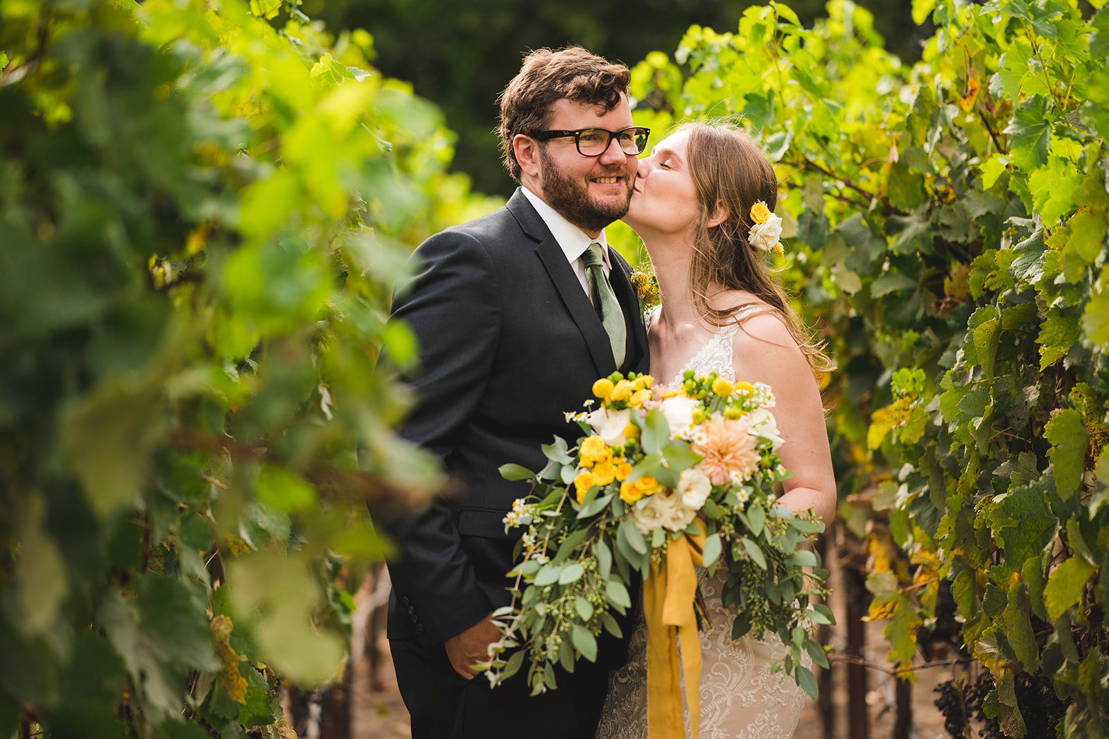 Newlyweds sharing a romantic moment among vineyards in Napa Valley