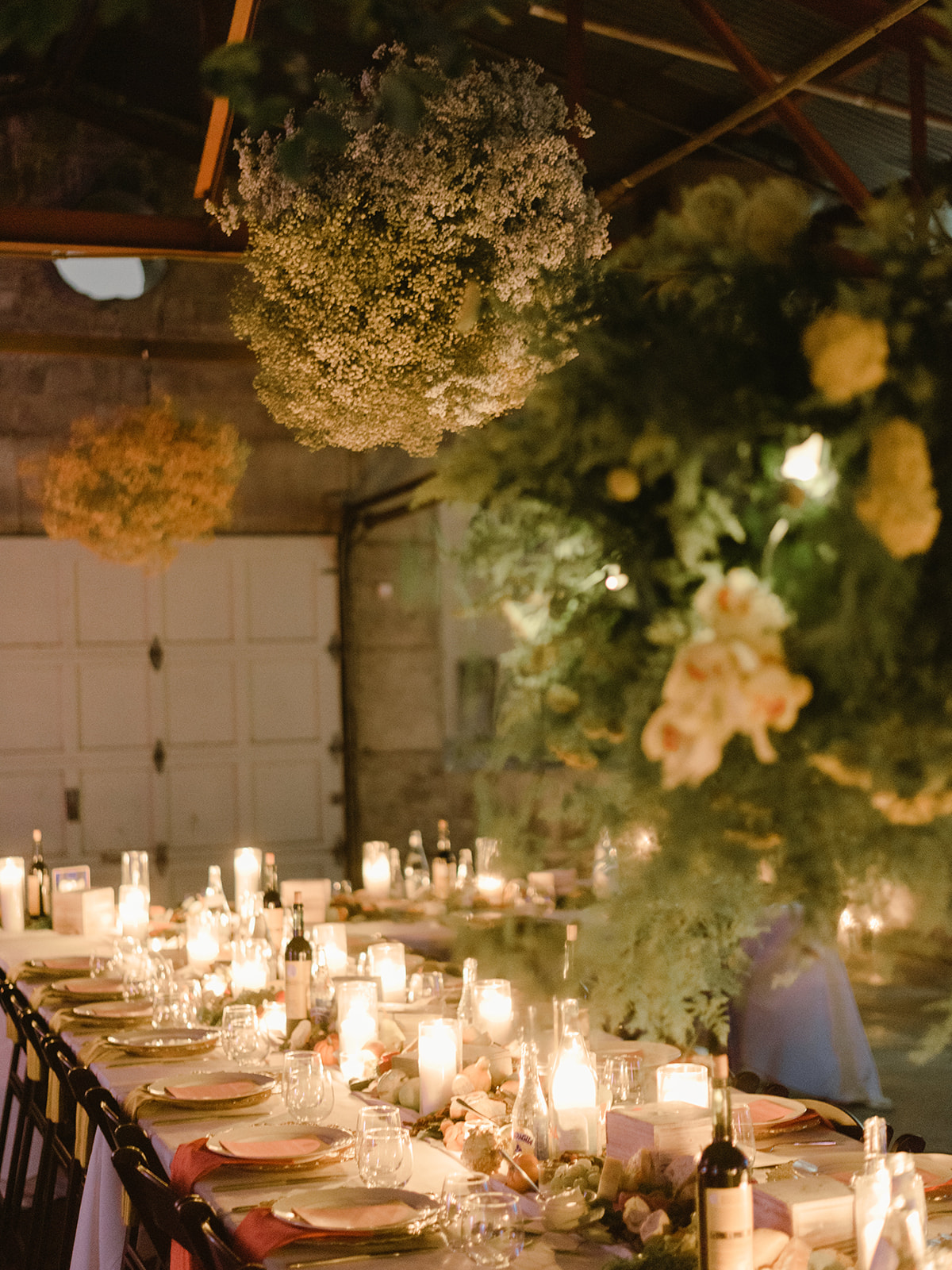An abundant floral installation ran the length of the warehouse and included trees provided by the Barn Nursery