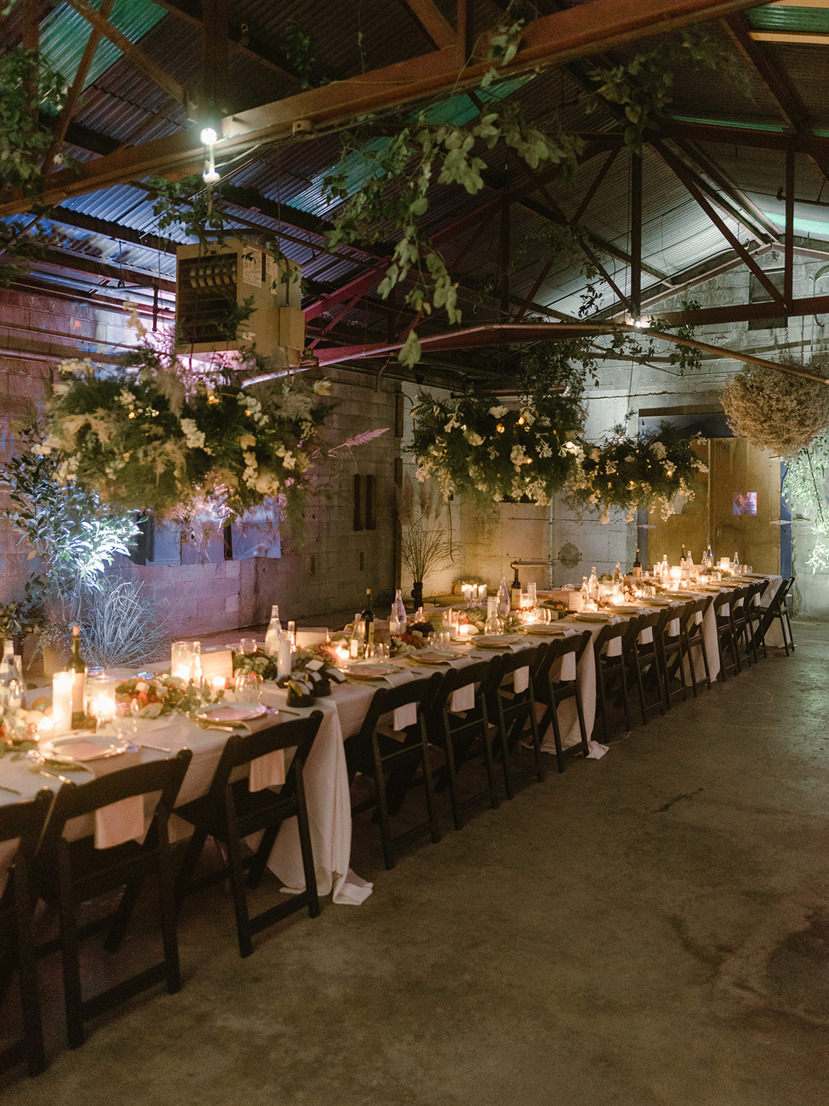 An abundant floral installation ran the length of the warehouse and included trees provided by the Barn Nursery