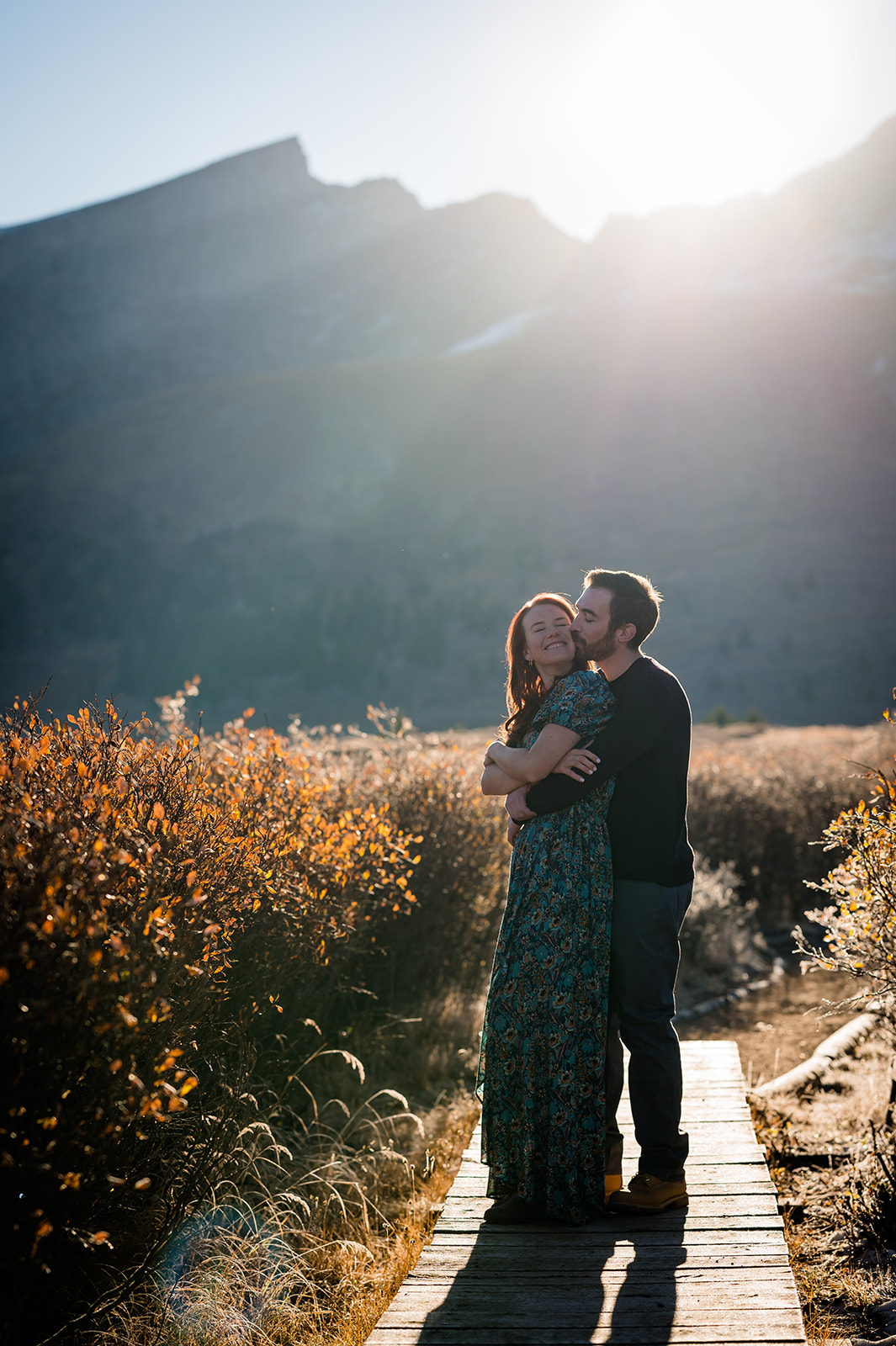 The sun shines over Guanella Pass for the first light of day at this adventure engagement session