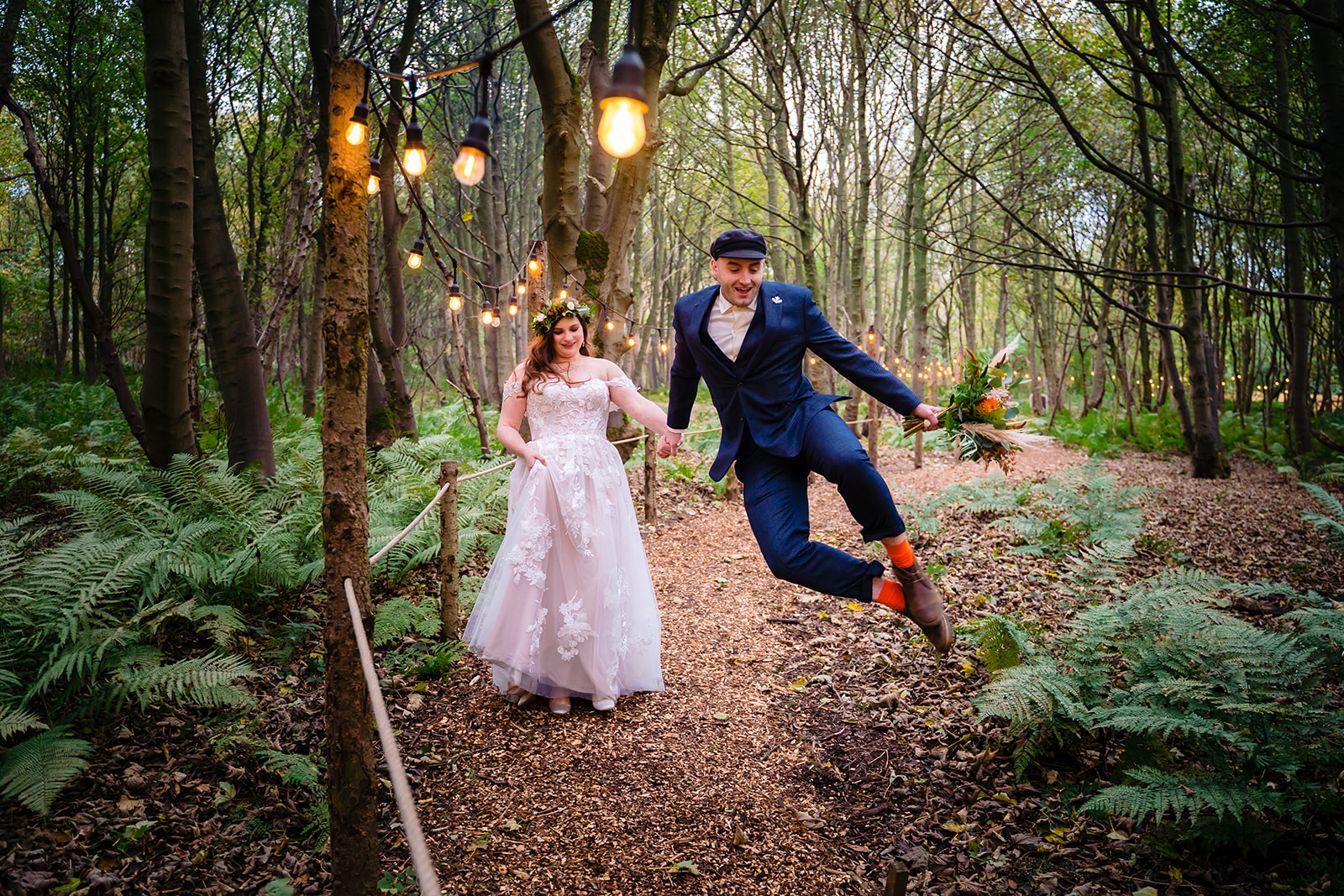 A groom goes a toe tap at  Cockley Wood Weddings