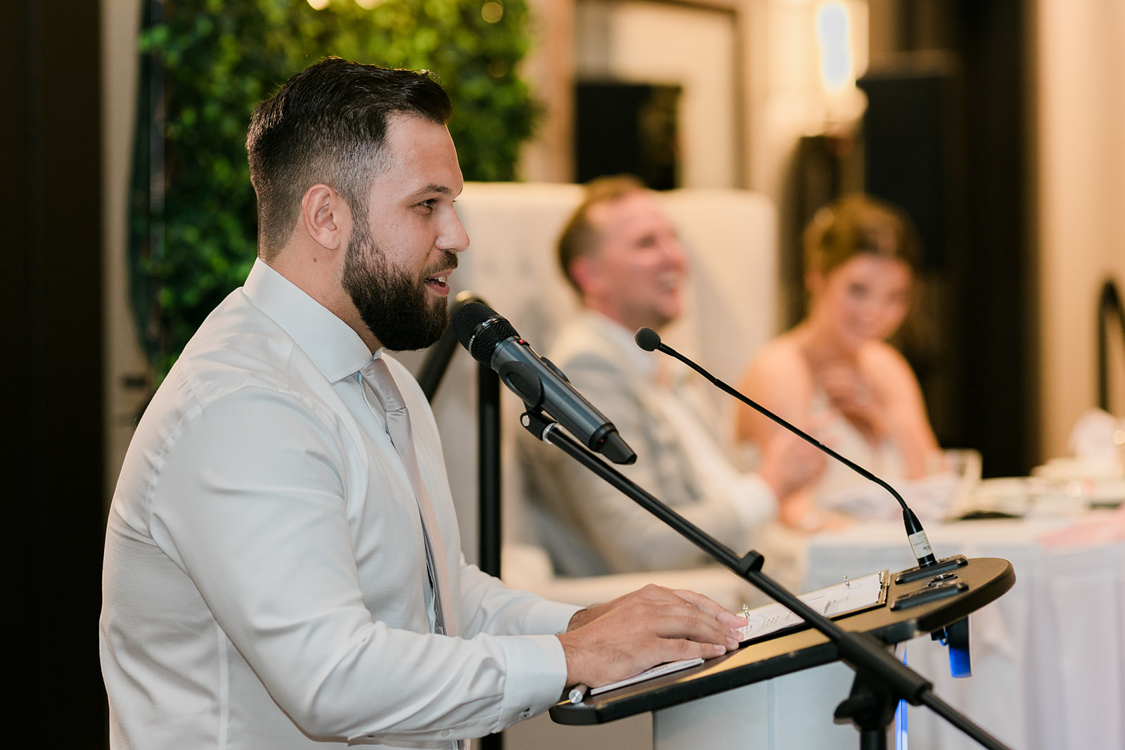 best man says funny toast during wedding reception
