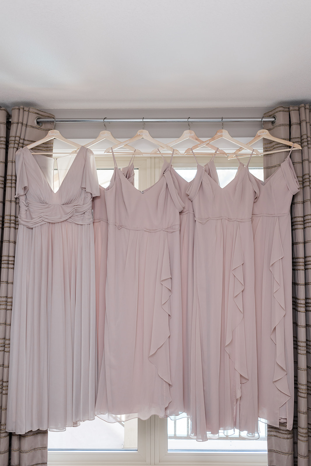 bridesmaids dresses hanging in window