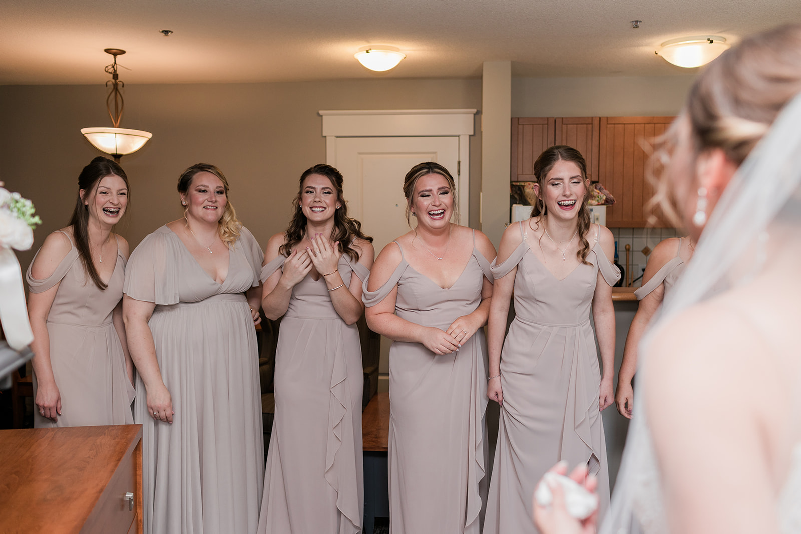 bridesmaids in surprise seeing bride for first time