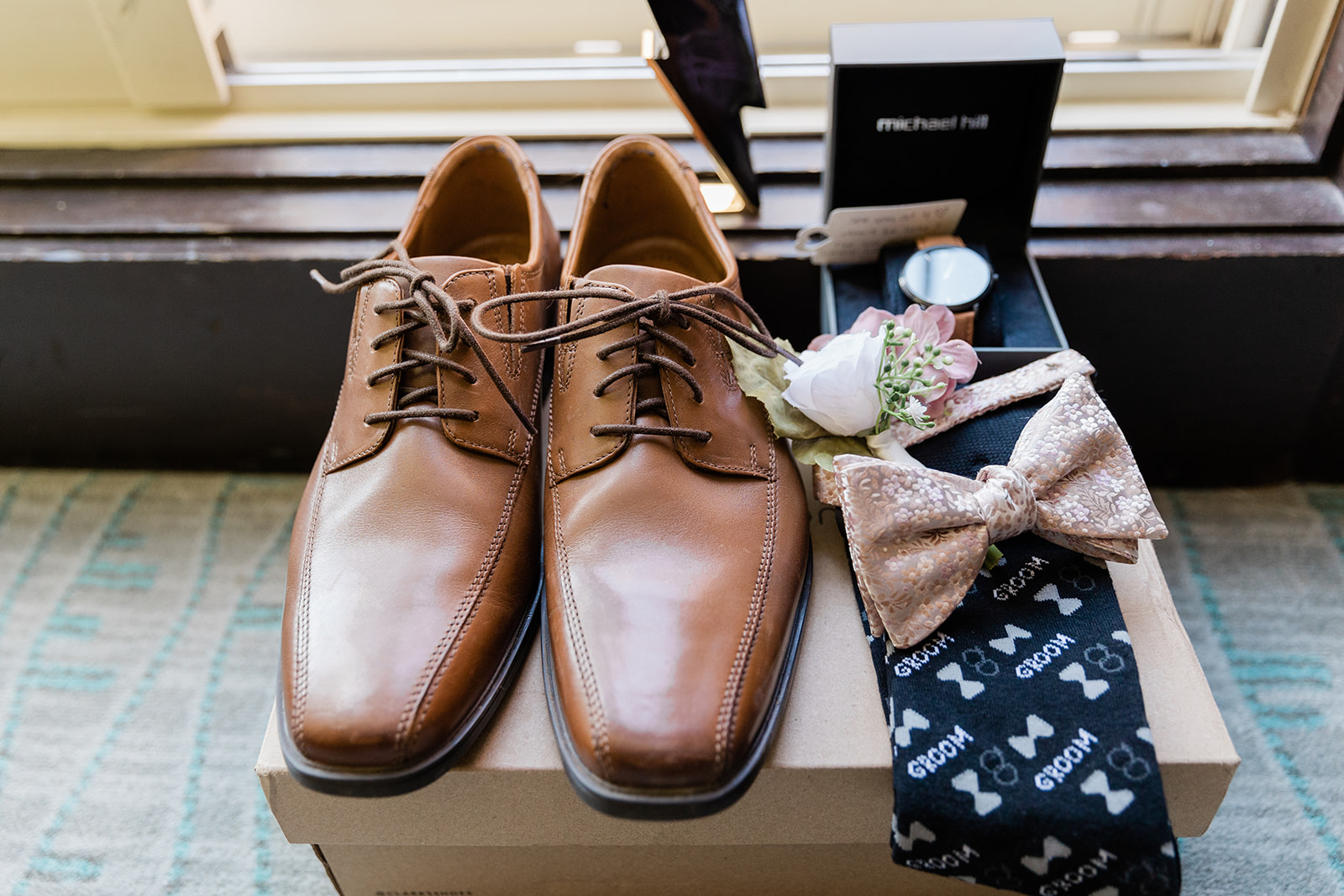 grooms details including shoes, socks, watch and bow tie