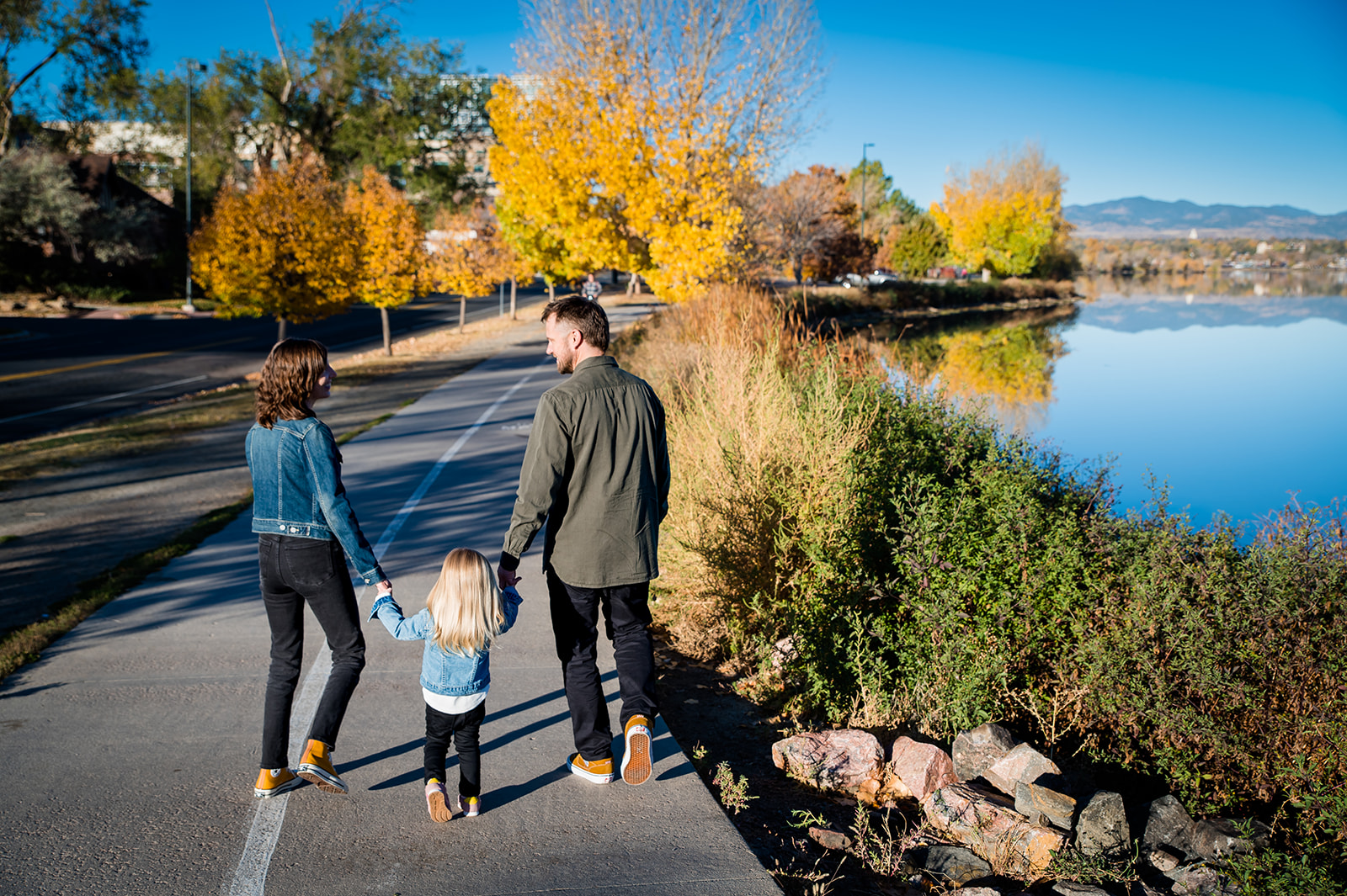 a family walks along sloane's lake in Denver