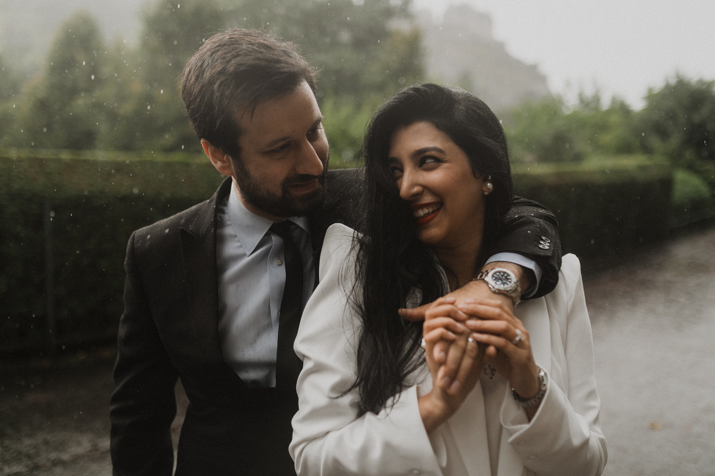 Couple embracing during post-wedding photoshoot at Princes Street Gardens, Edinburgh, Scotland