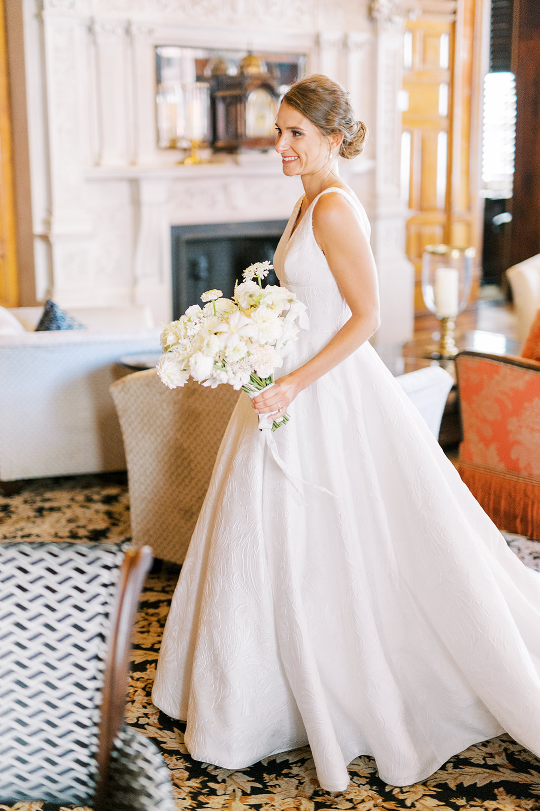 classic bride walks across cigar room in dramatic ballgown at union league of philadelphia wedding