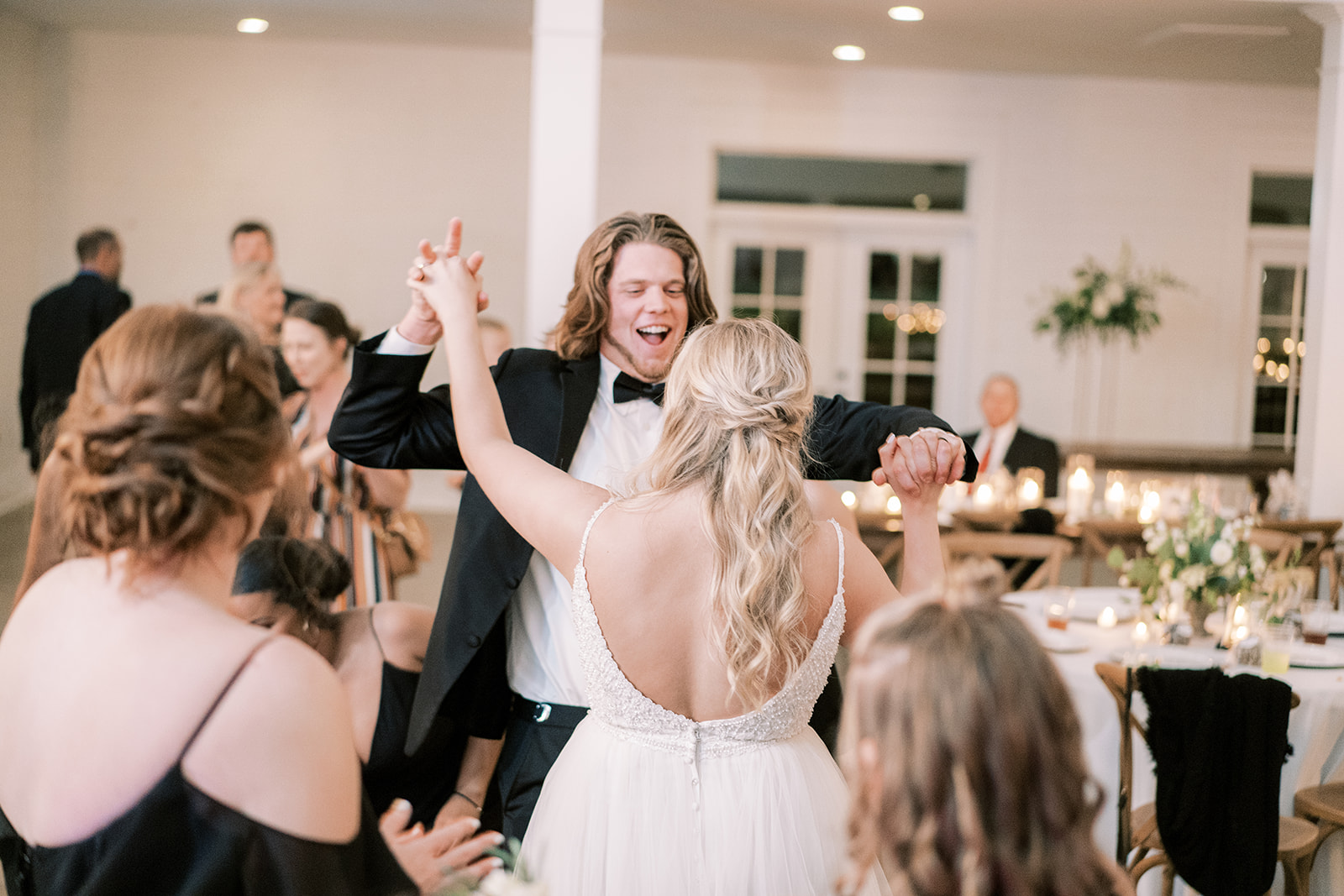 The bride and groom dance at their reception at Harvest Hollow in Huntsville, Alabama