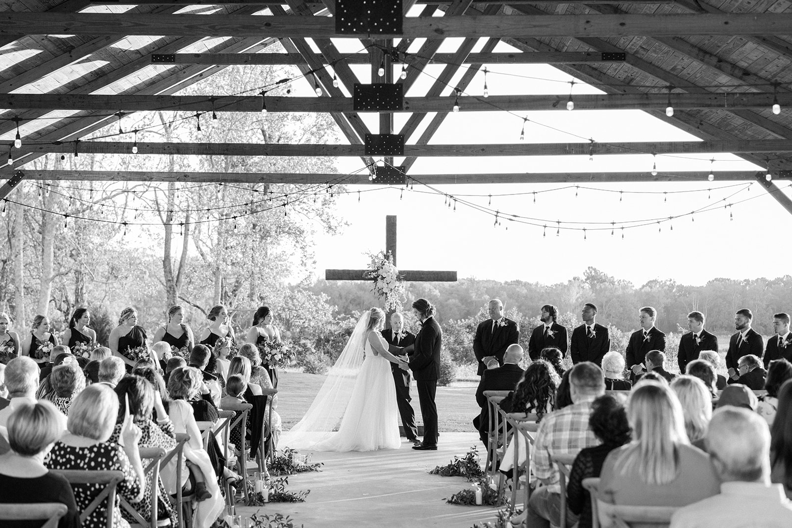 A wedding ceremony in black and white at Harvest Hollow in Toney, Alabama