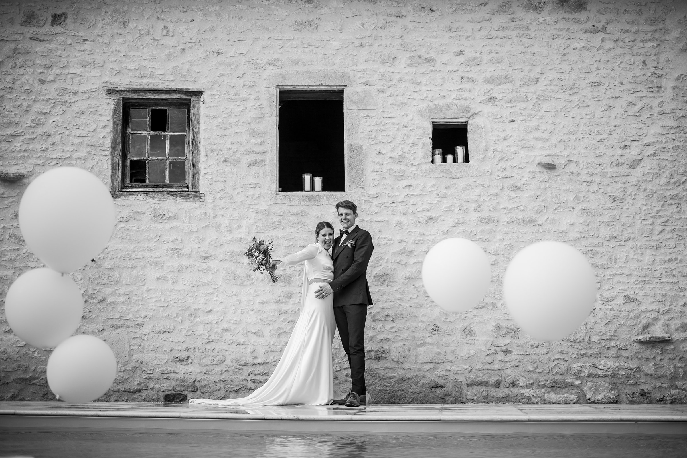 Destination wedding in Benest France, couple by swimming pool