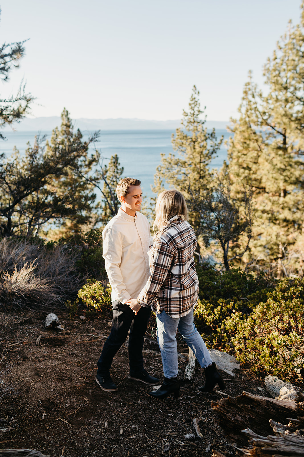 Couple holding hands in Lake Tahoe