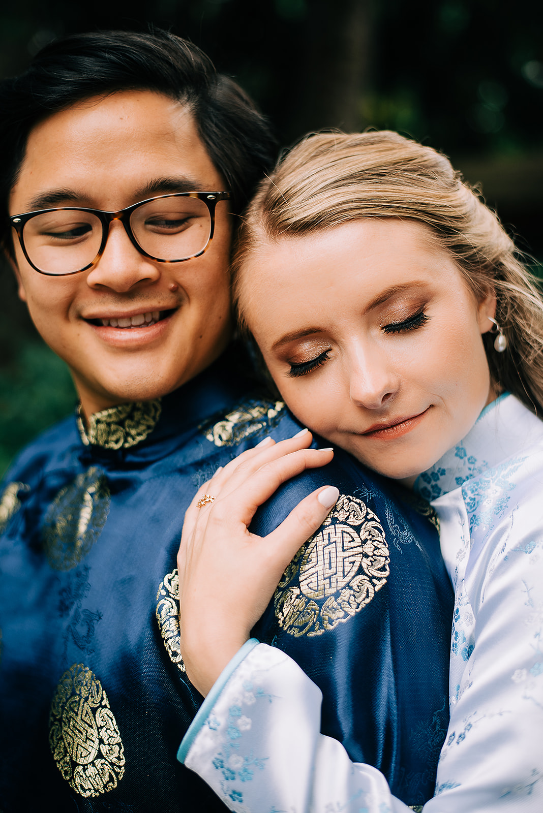 Interracial couple photographed in traditional ao dai attire at engagement session at Kubota garden in Seattle