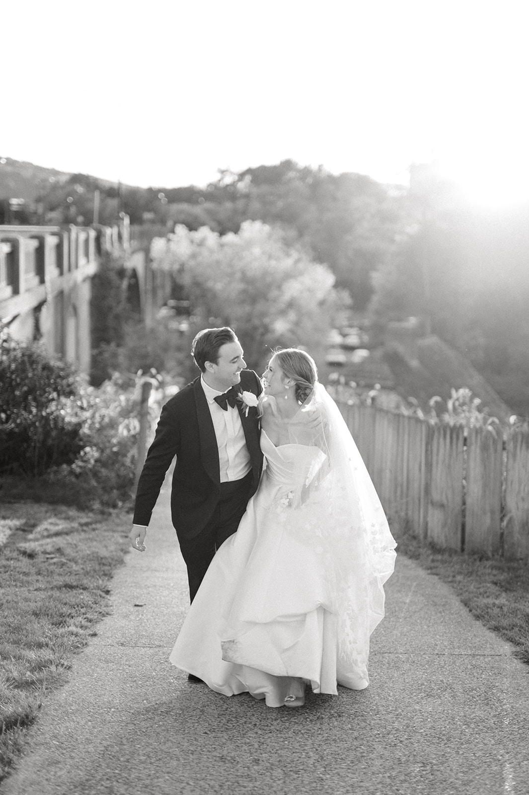 black and white photo of bride and groom in bethlehem sunset