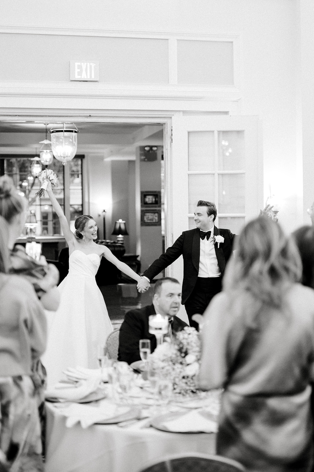 black and white photo of bride and groom entering hotel bethlehem wedding reception