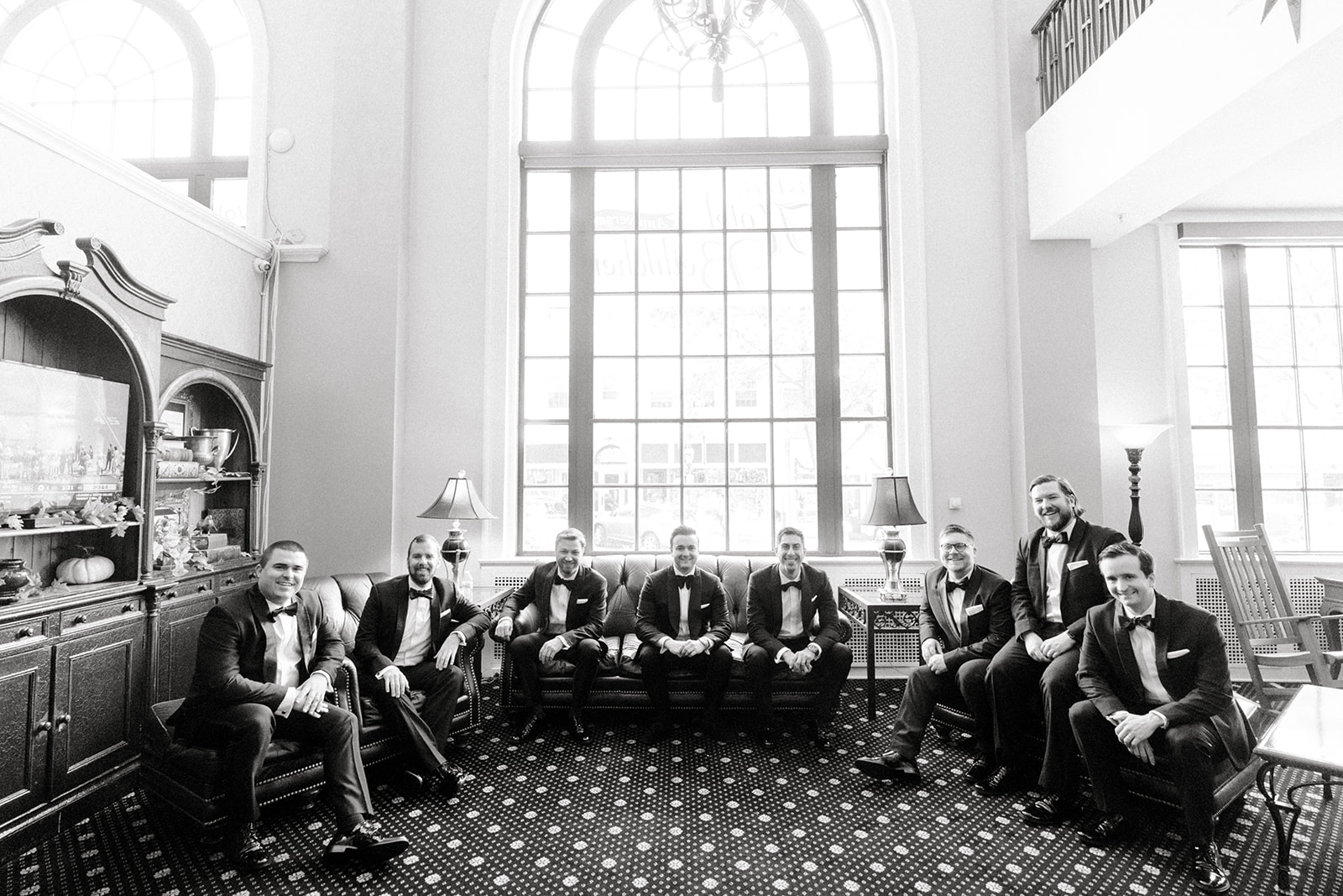 black and white photo of groomsmen in hotel bethlehem lobby
