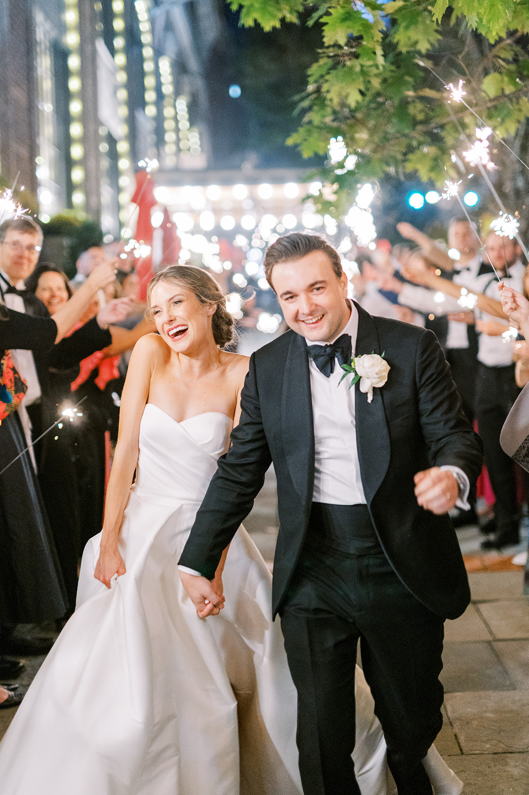 bride and groom exiting hotel bethlehem wedding down aisle of sparklers