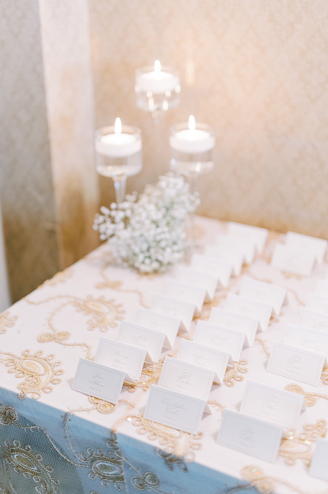white and gold place cards laid out at hotel bethlehem wedding