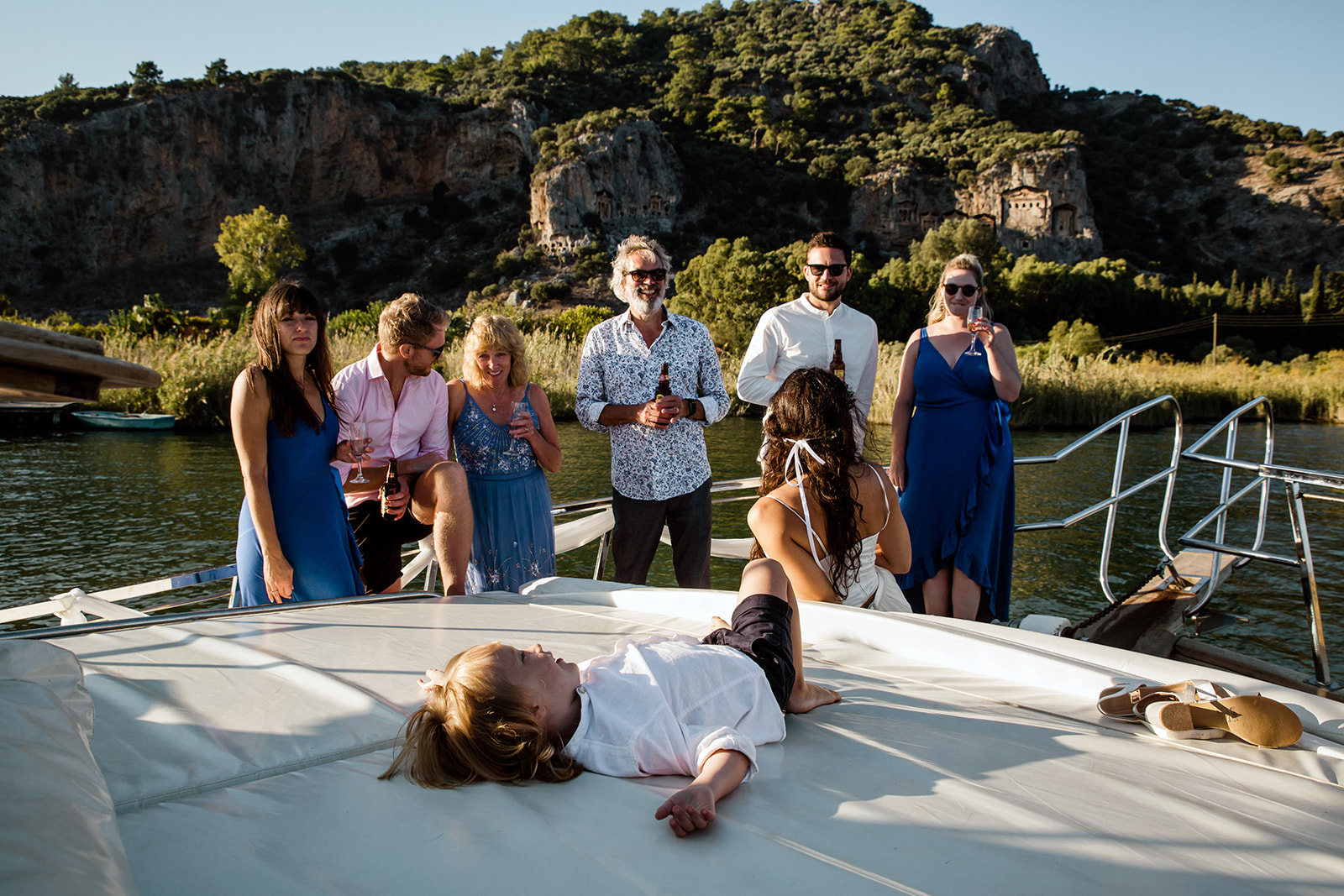 Family shooting in the boat with the view of the Dalyan rock tombs after the wedding