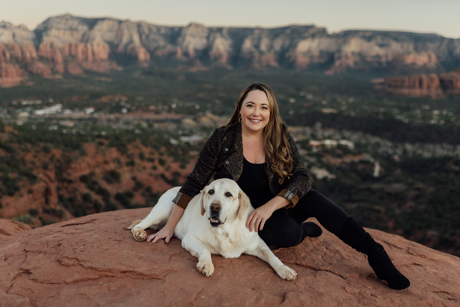woman with arms around her dog in Sedona