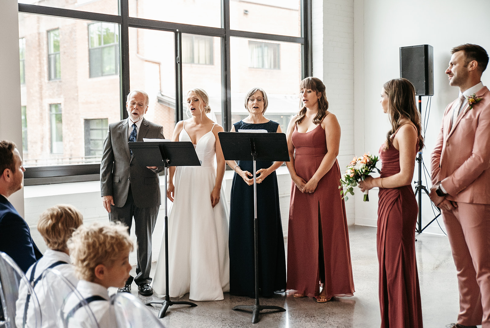 Bride and her family singing to her husband on their wedding day!