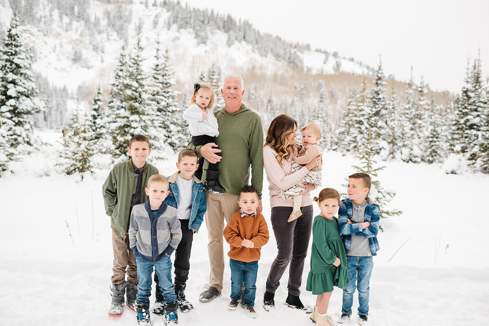 Kids and Grandparents pose at snowy Silver Lake up Big Cottonwood Canyon in Utah Family Photograph