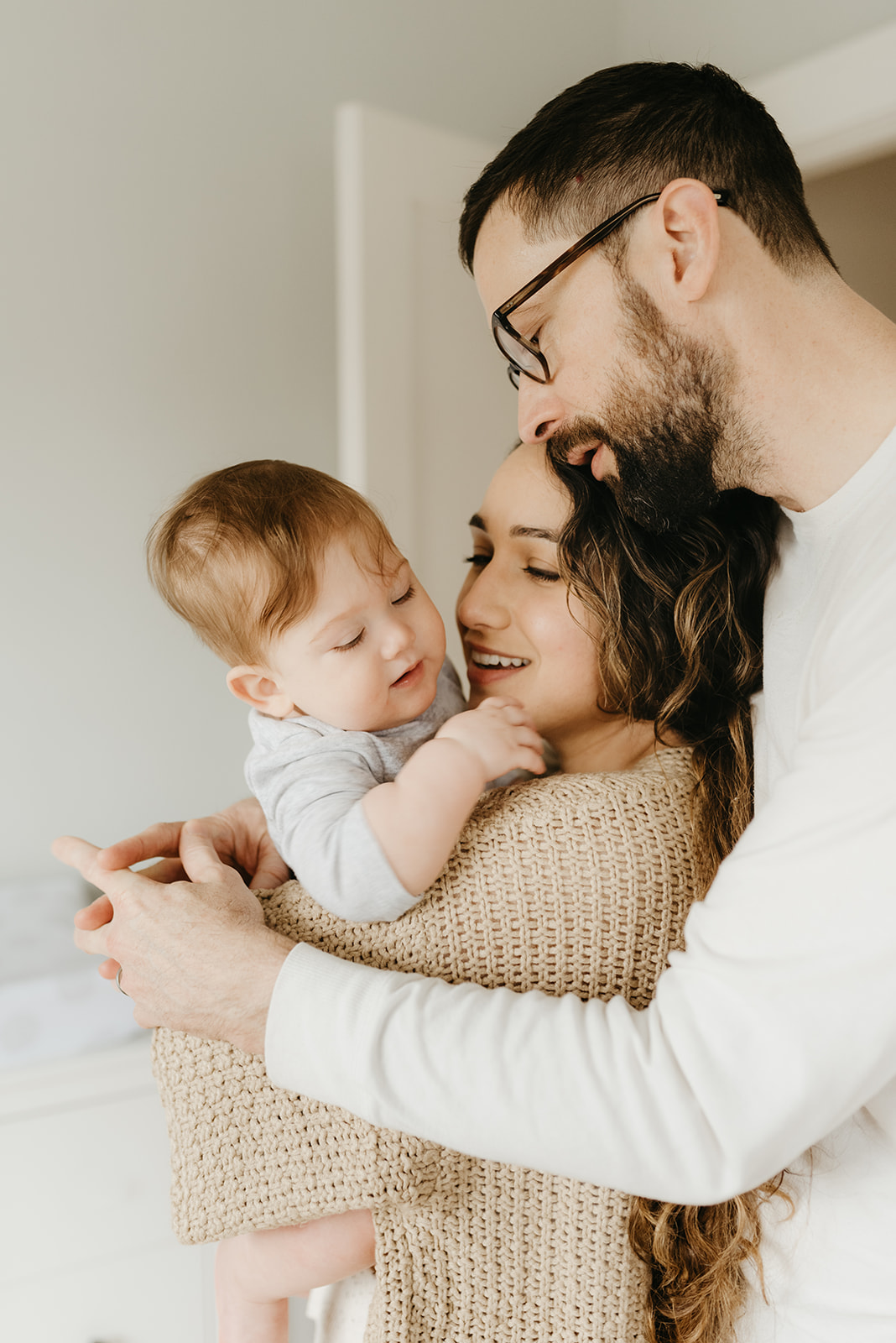 A tender in-home photography session with mother, father and baby in Portland, Oregon. 
