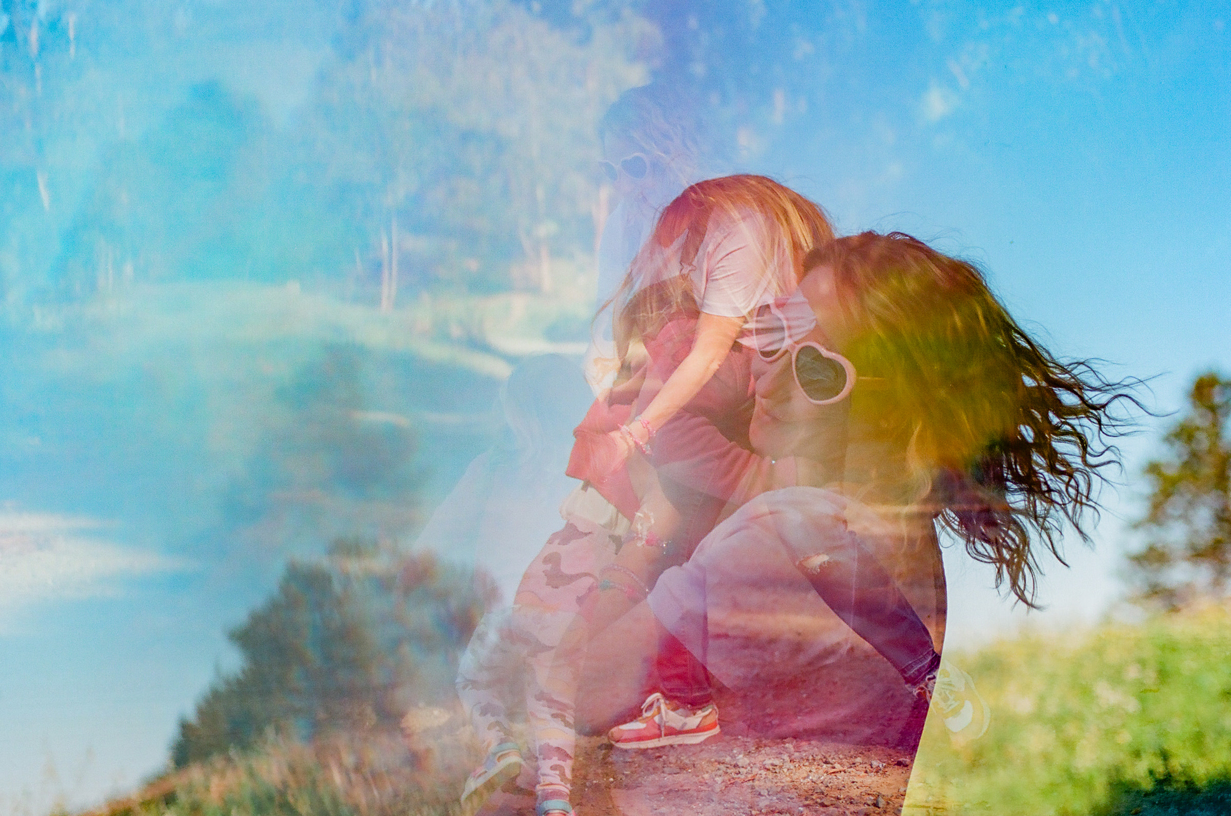 double exposure of mom holding toddler daughter and swinging her around