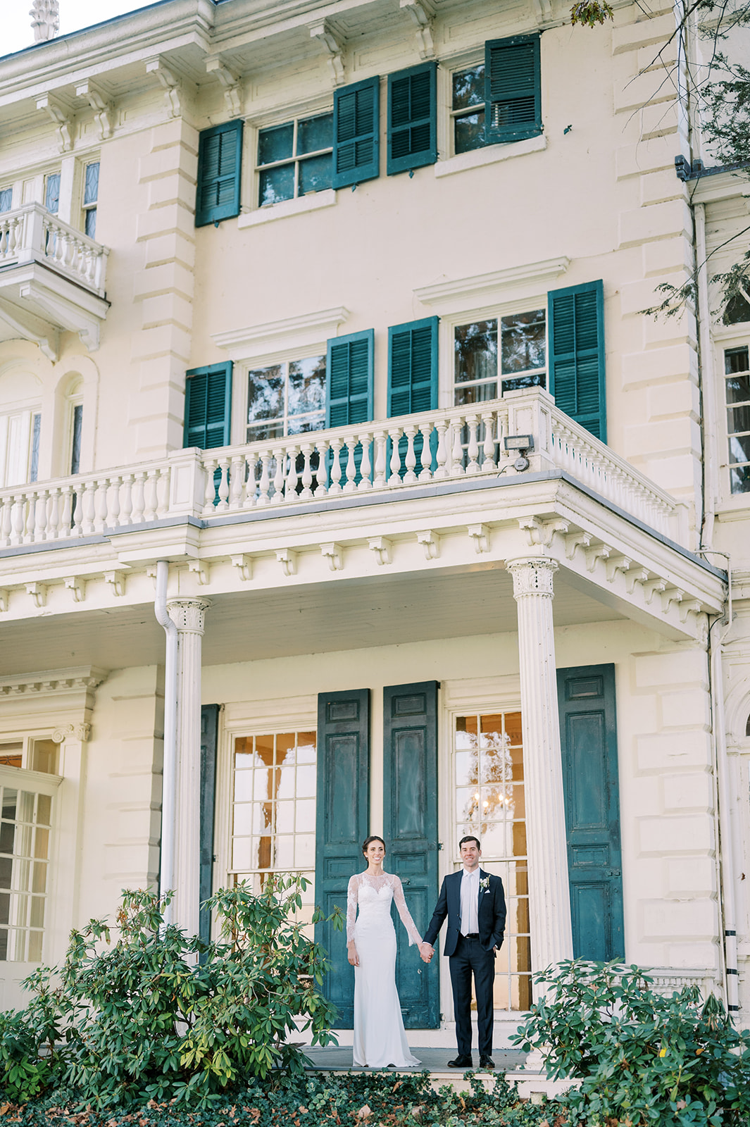 couple standing on the porch at glenn foerd mansion 
