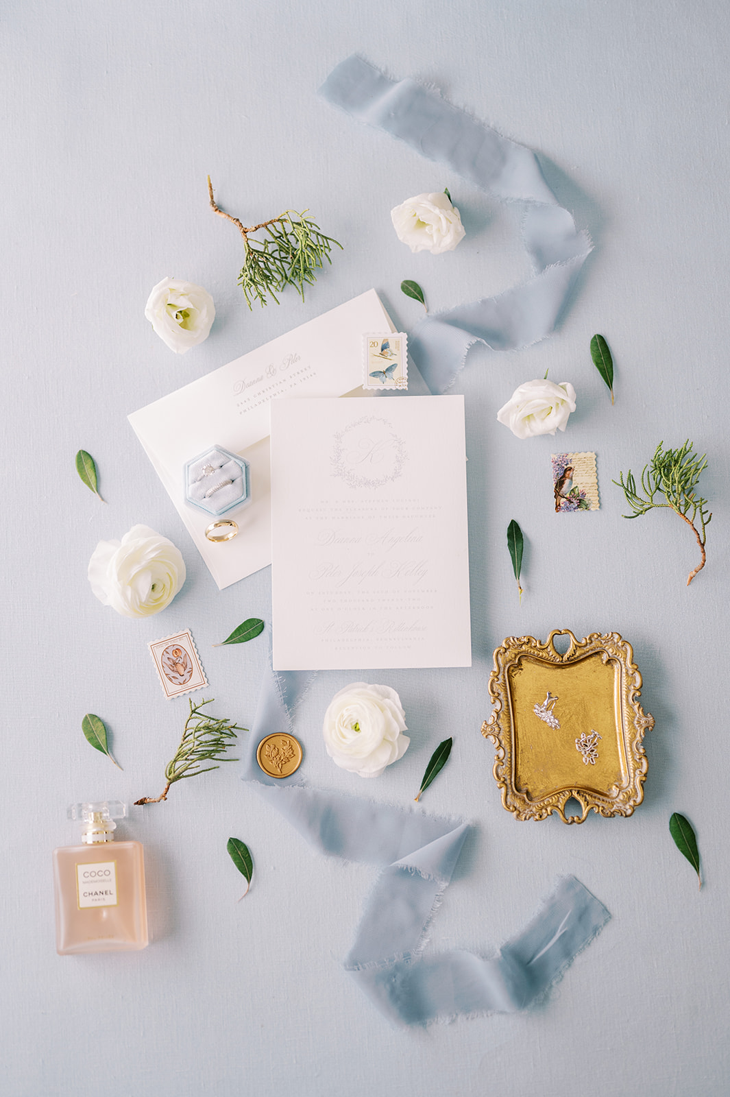 flat lay details with blue ribon