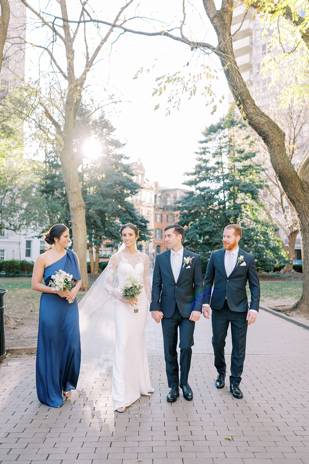 small bridal party shot walking in rittenhouse square