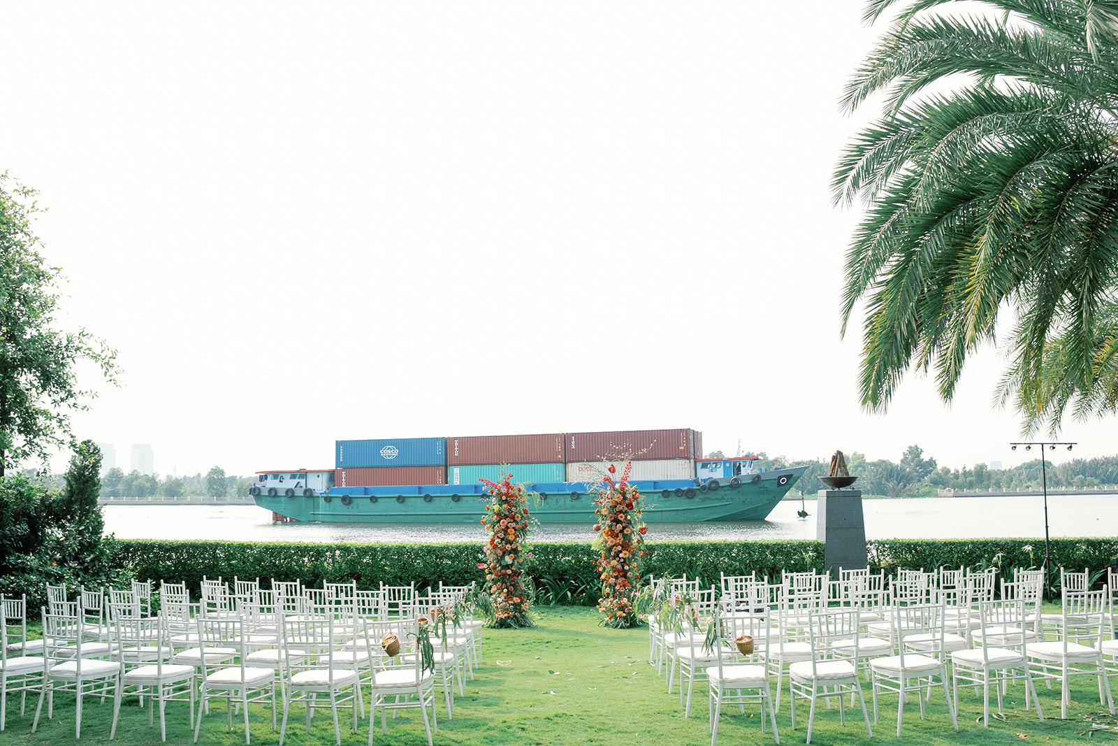 wedding arch tropical style river side green