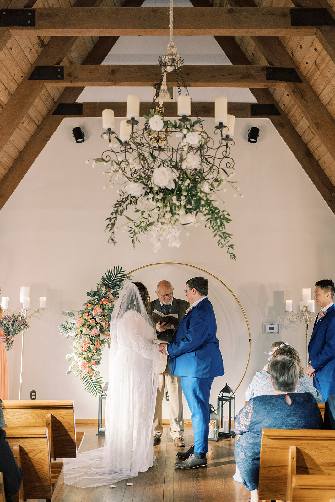 The bride and groom stand at the altar of the chapel at Fernwood in Mentone, Alabama