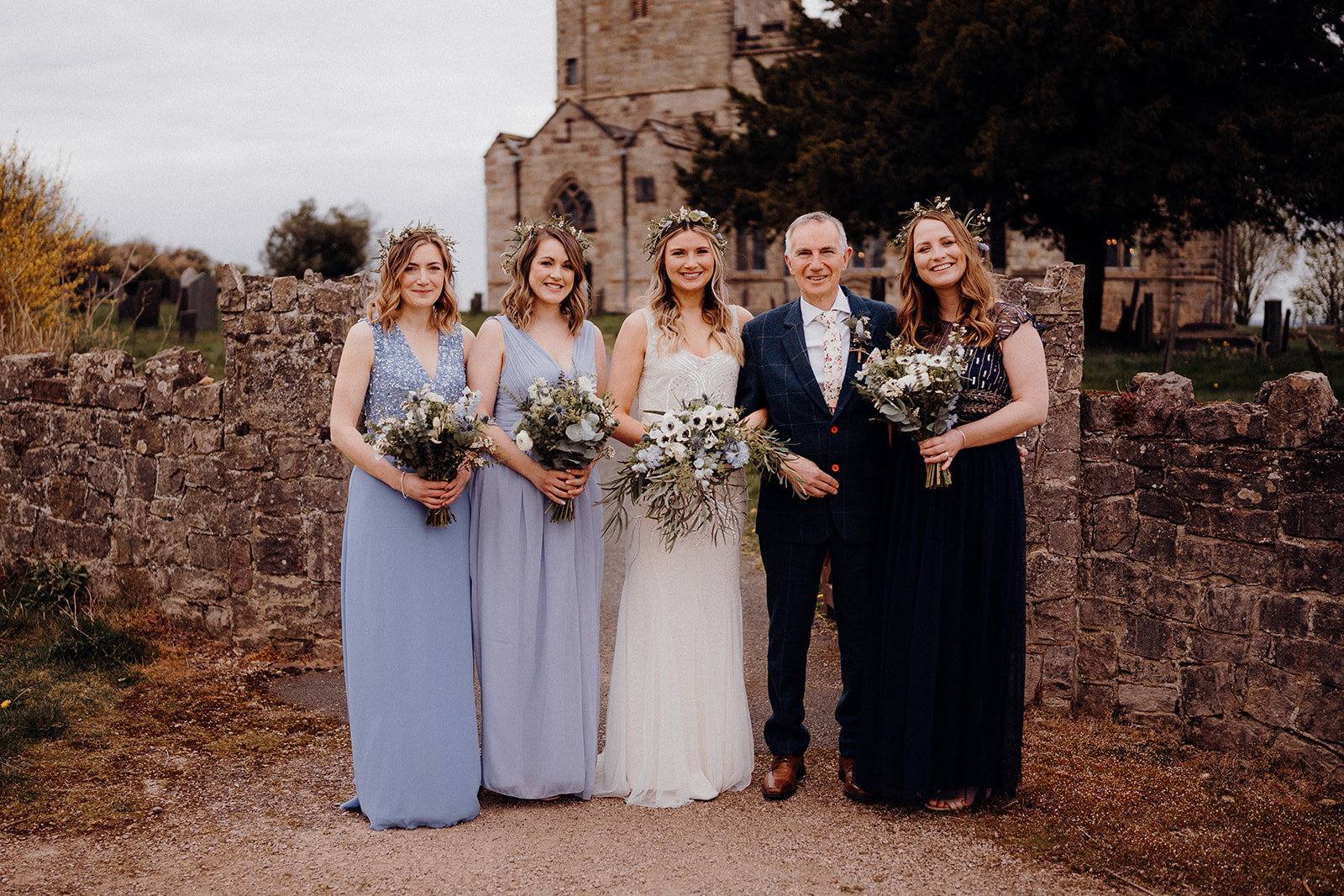 boho bridesmaids with bride outside church, Breedon on the hill