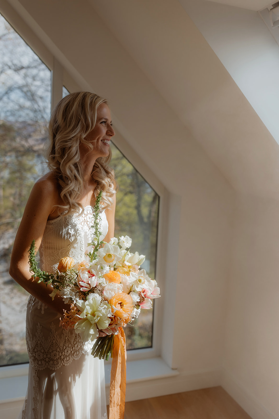 Kara wearing her gorgeous bridal gown while holding her bouquet for her Isle of Skye elopement