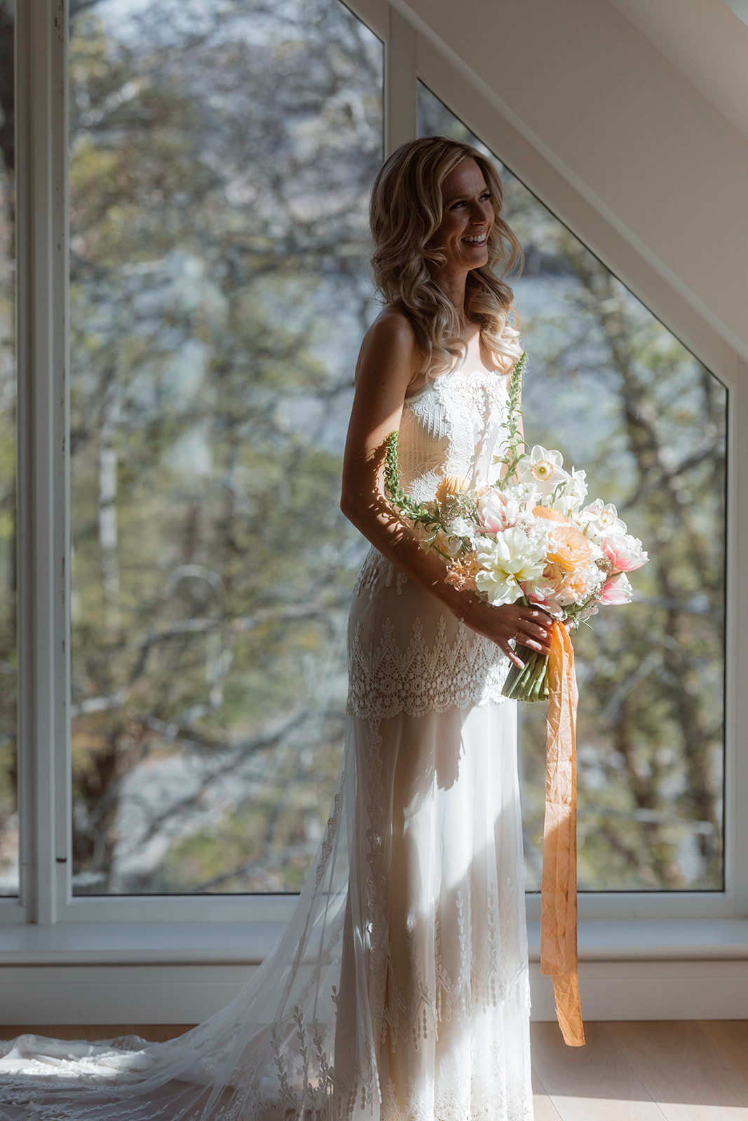 Kara wearing her gorgeous bridal gown while holding her bouquet for her Isle of Skye elopement