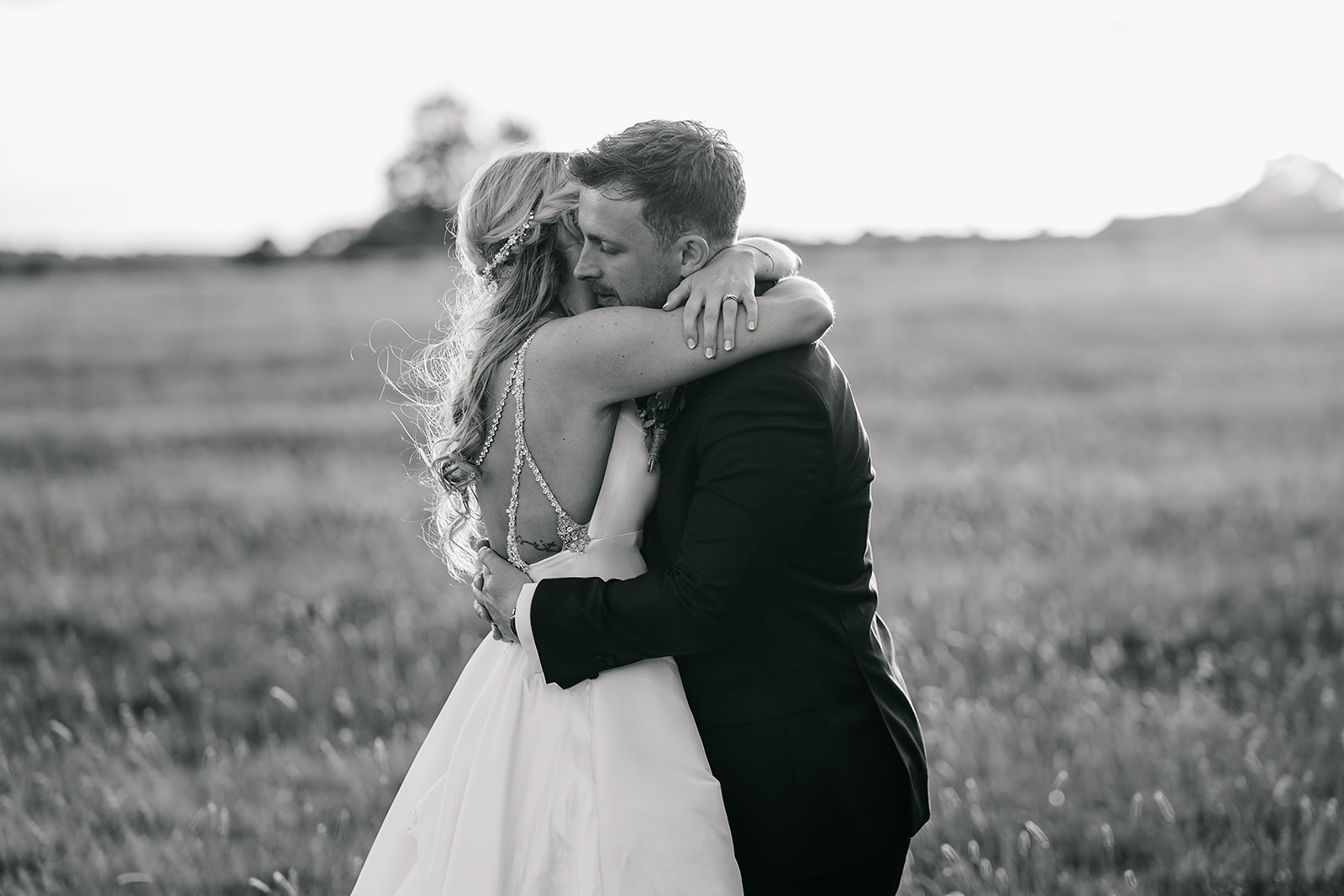 black and white bride and groom enjoying sunset at hornington manor