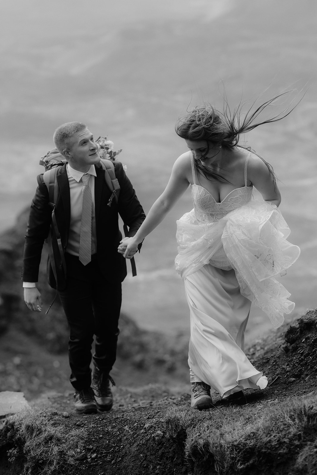 Emma and Matthew embrace a romantic stroll at the Quiraing, Isle of Skye, during their enchanting elopement day.