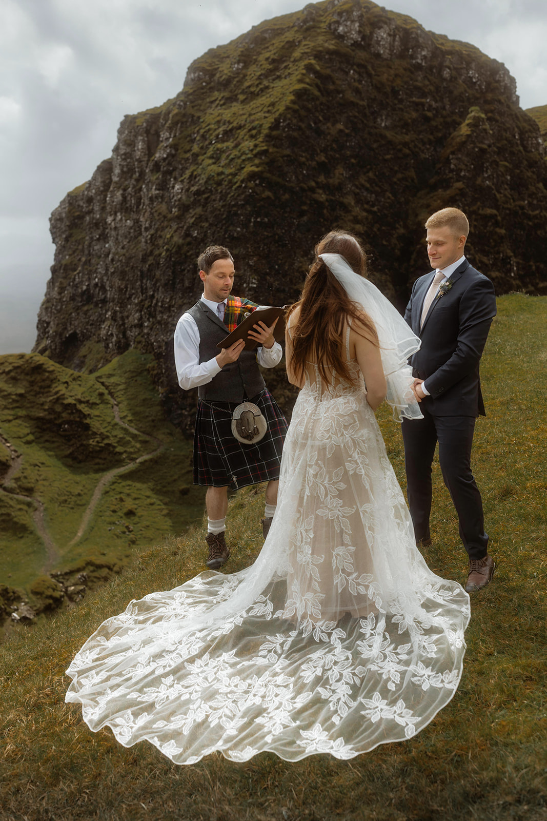 Step into a world of wonder as Emma and Matthew exchange vows at their enchanted elopement ceremony in the Quiraing, Isl