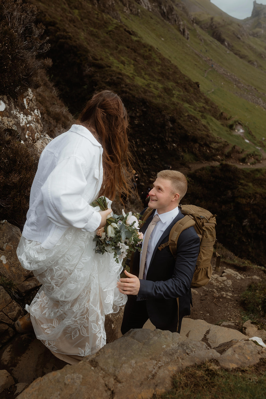 Elopement couples Emma and Matthew walked hand in hand at Quiraing, Isle of Skye.