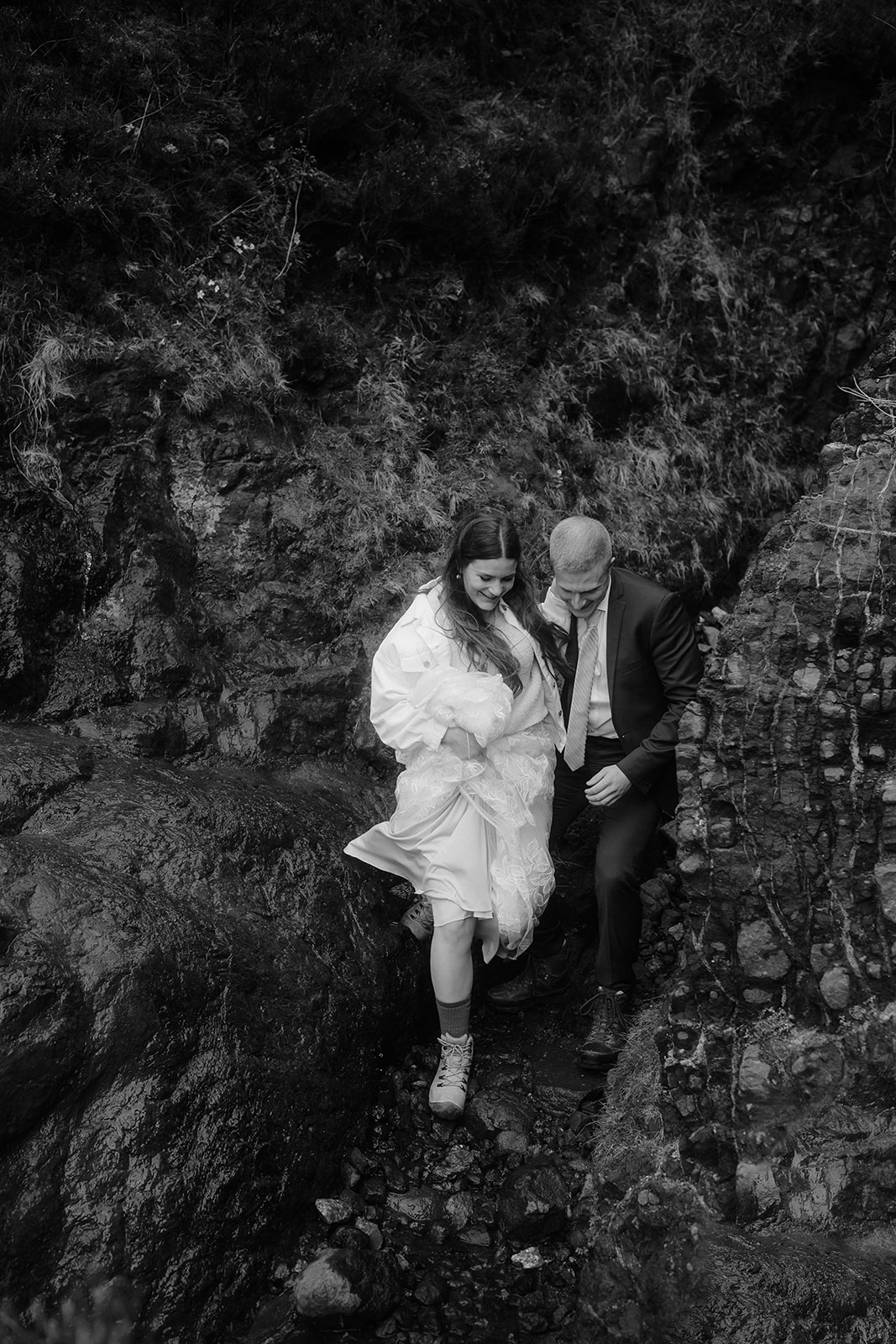 Capture in a tender moment, Emma and Matthew stroll through Quiraing, Isle of Skye during their elopement day.