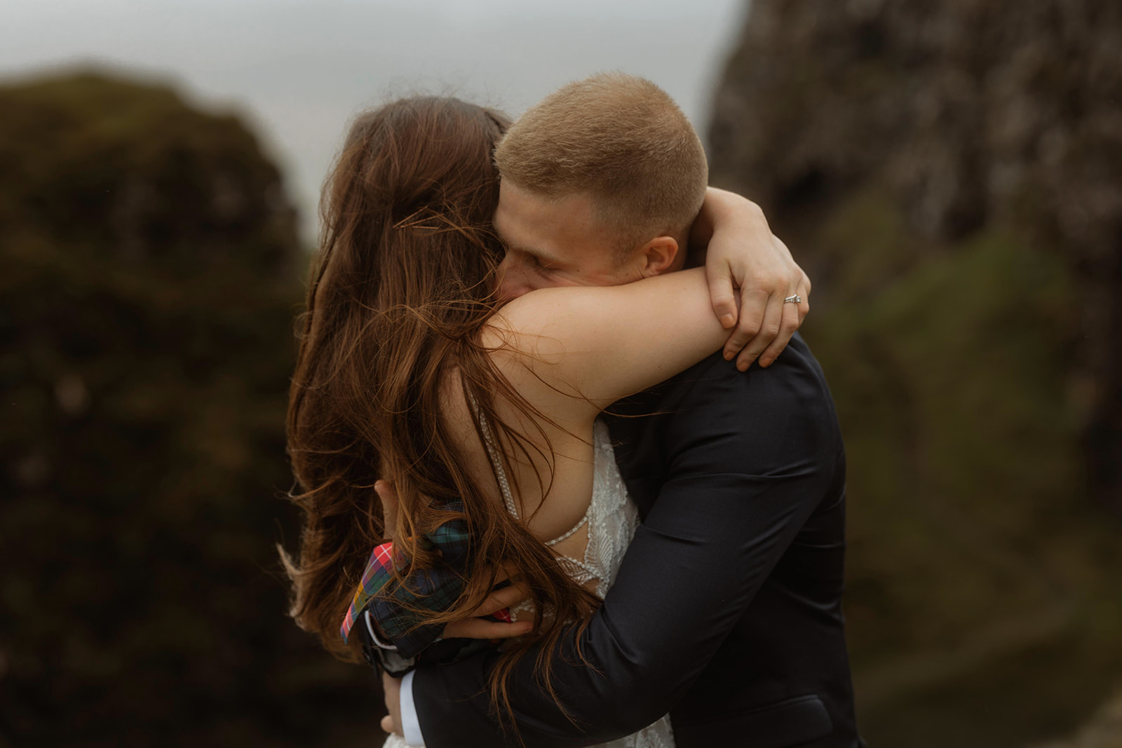 Emma and Matthew shared a loving hug during their Isle of Skye elopement