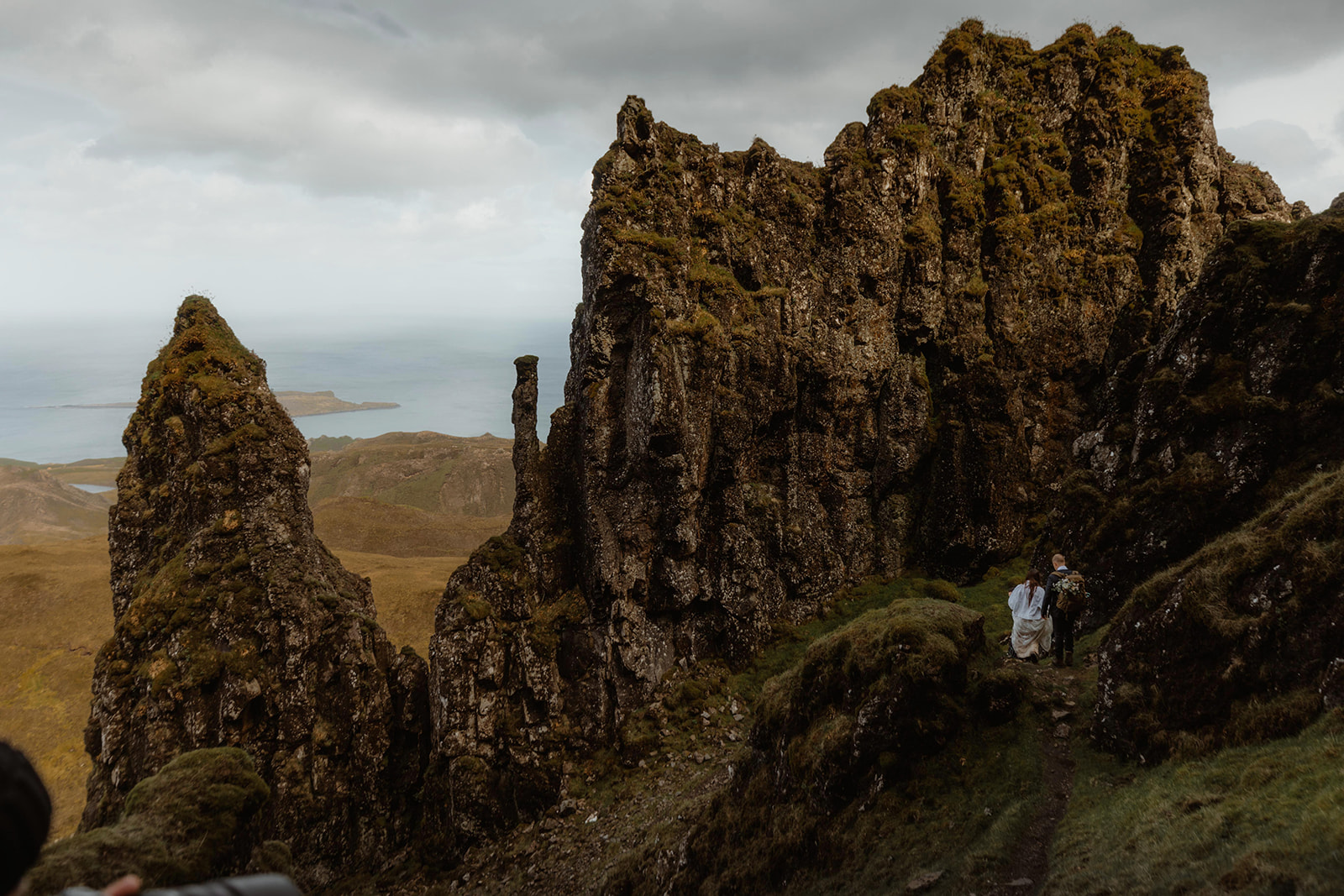 Emma and Matthew shared an intimate moment as they hike down after their Isle of Skye elopement ceremony