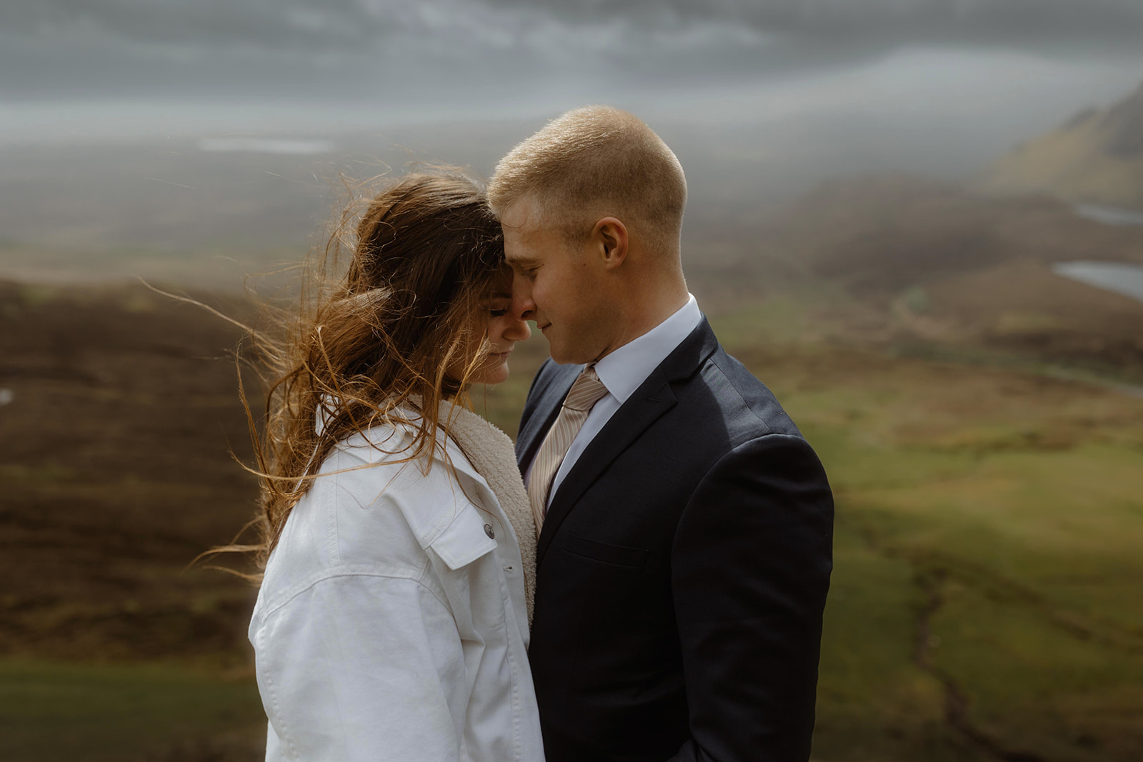 Emma and Matthew share a loving gaze on their Isle of Skye elopement day, capturing their deep connection.