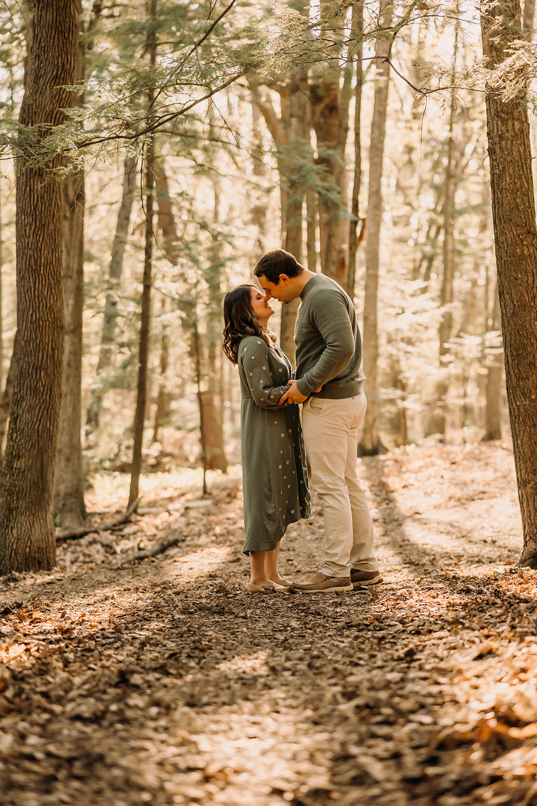 Beautiful husband and wife framed by the stunning outdoor scenery in a family photoshoot