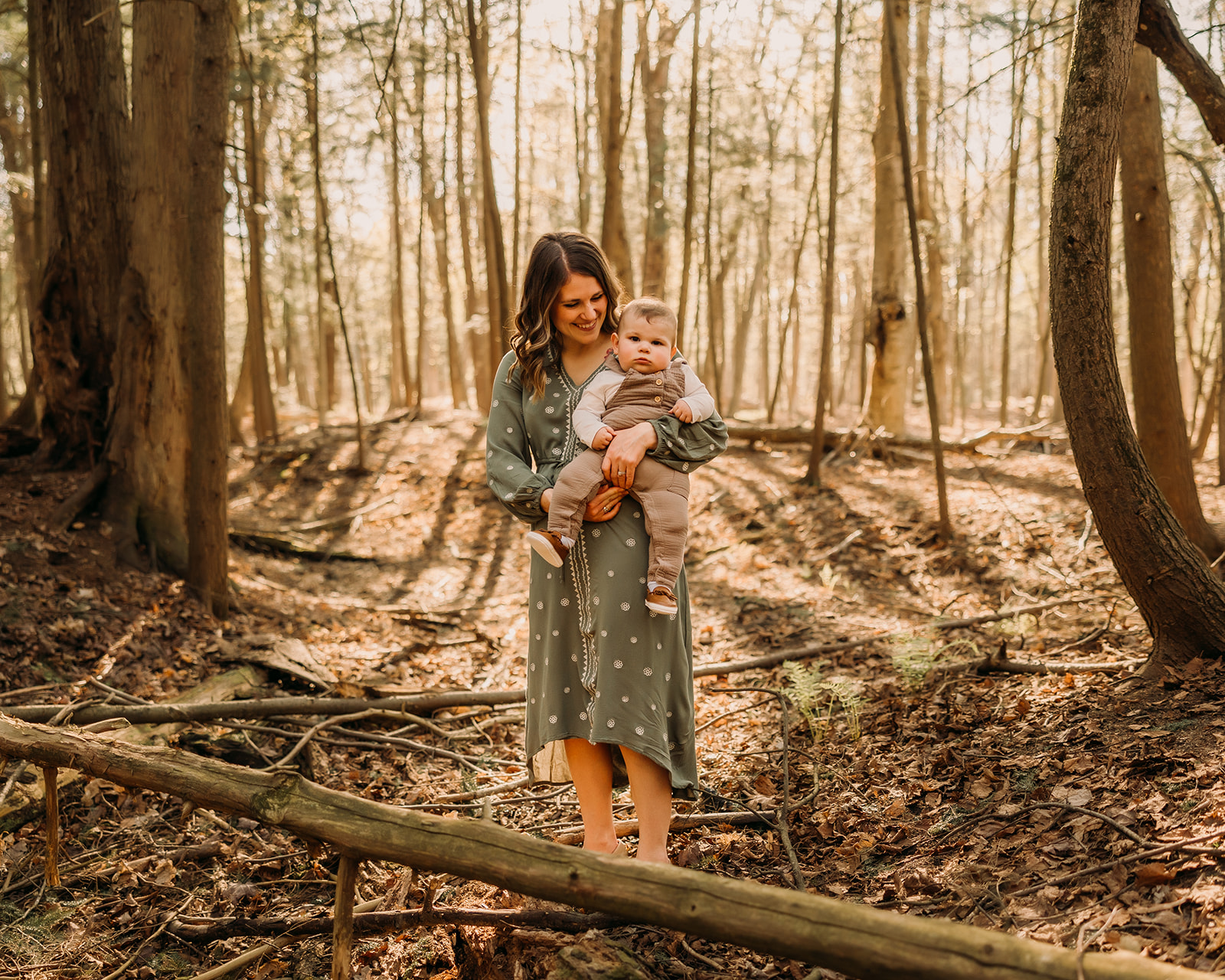 Loving mother and child capturing memories in a forest photoshoot