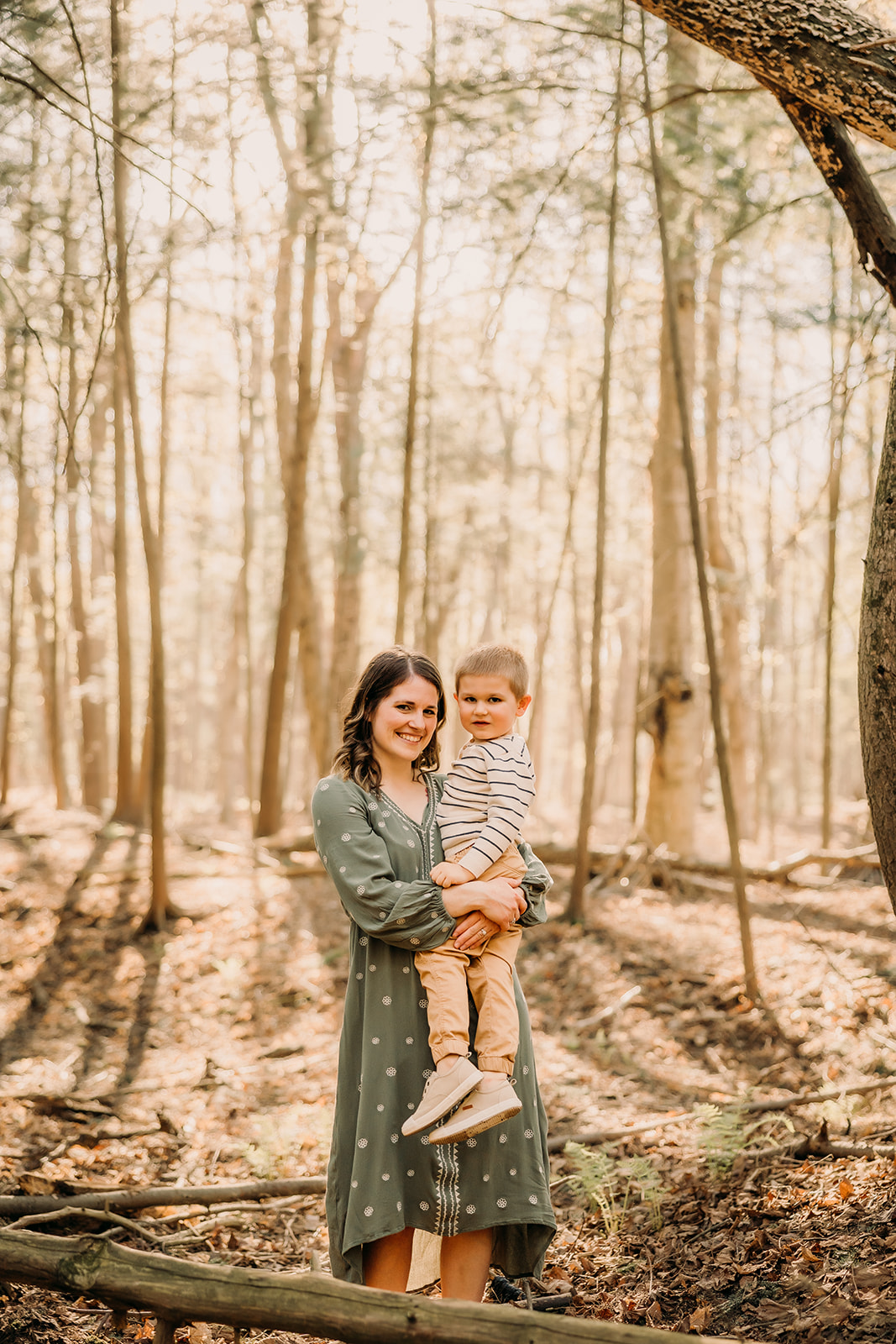 Tender moments captured between mother and child in a forest photoshoot