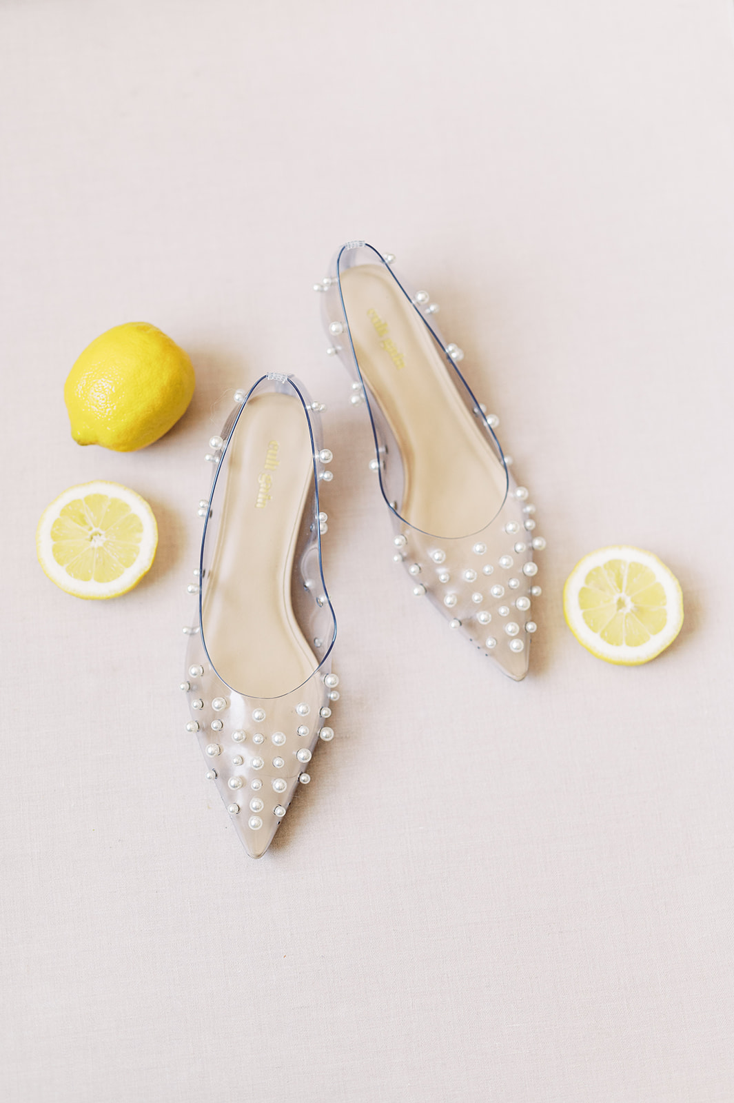chic pearl adorned jelly flats for this bride's Bright Summer Stone Harbor Golf Club Wedding in Yellow and Blue
