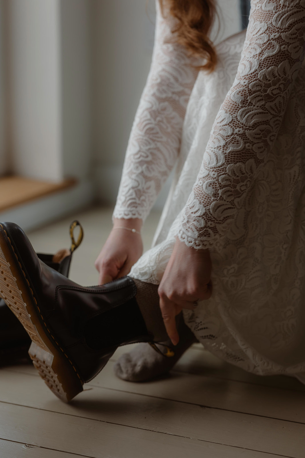Holly looks beautiful in her white dress and shoes as she gets ready for her Glencoe elopement ceremony.